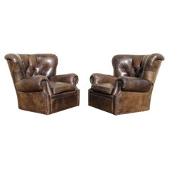 Pair of Restoration Hardware Churchill Tufted Leather Swivel Chairs