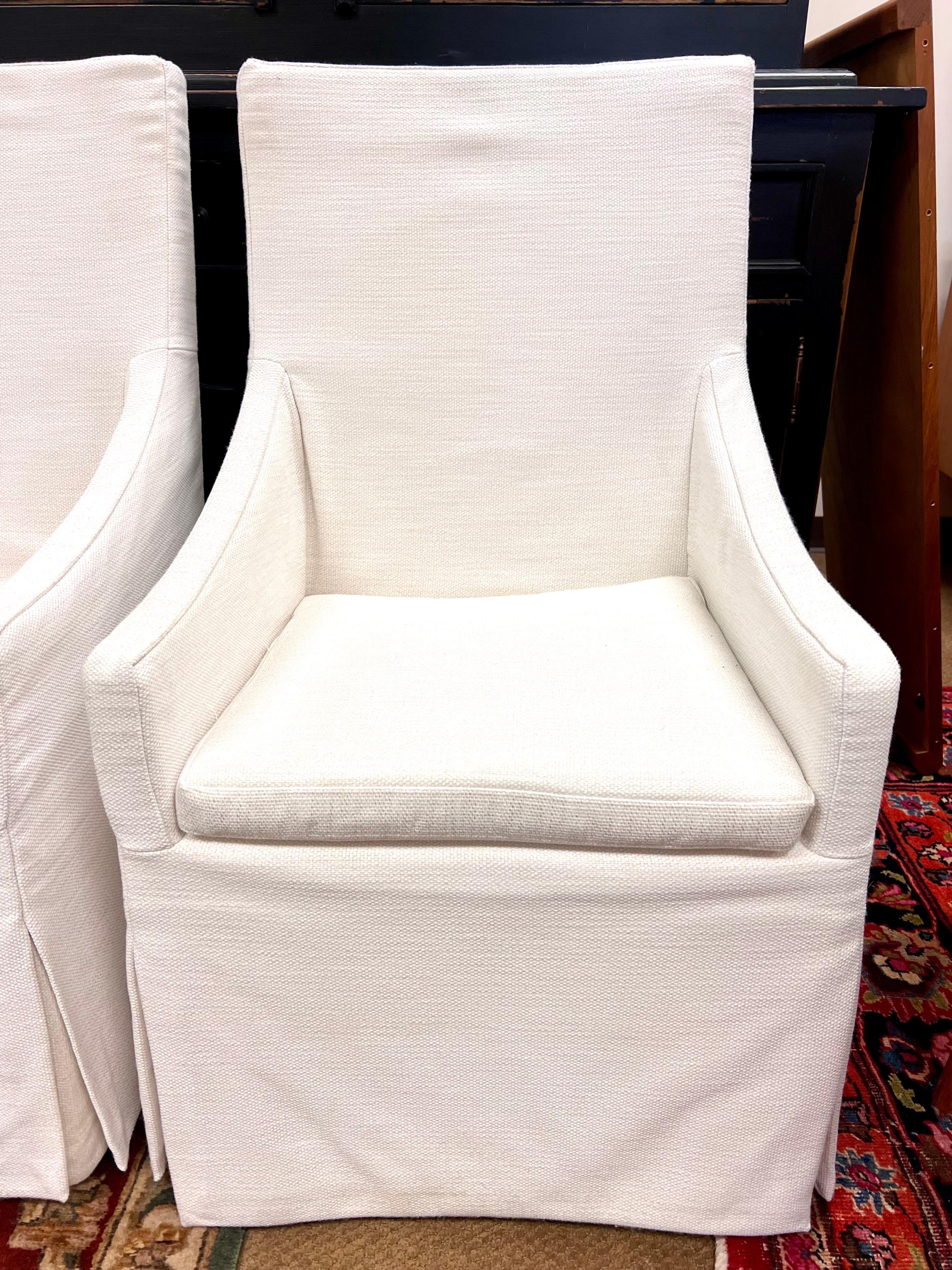 Elegant pair of RH Belgian linen slop arm dining chairs.  Look for accompanying set of side chairs also from RH in a separate listing
on Dibs as well.  These are big and heavy chairs.  We are based in CT on the east coast of the US and may be able