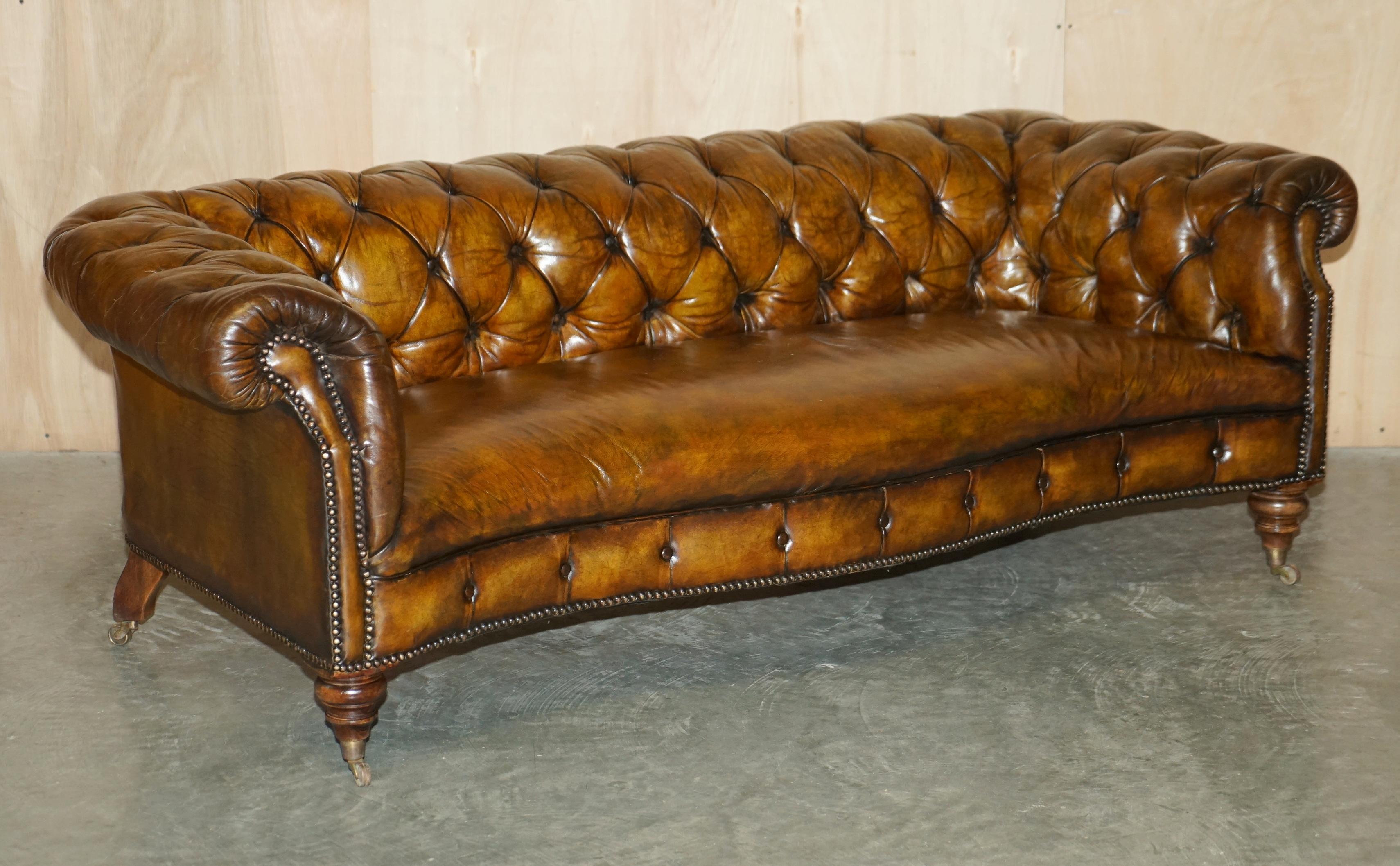 We are delighted to offer for sale this stunning pair of fully restored Victorian hand dyed cigar brown leather serpentine fronted Chesterfield Tufted club sofas after Howard & Son's of Berners Street.

These sofas are as rare as they come, they