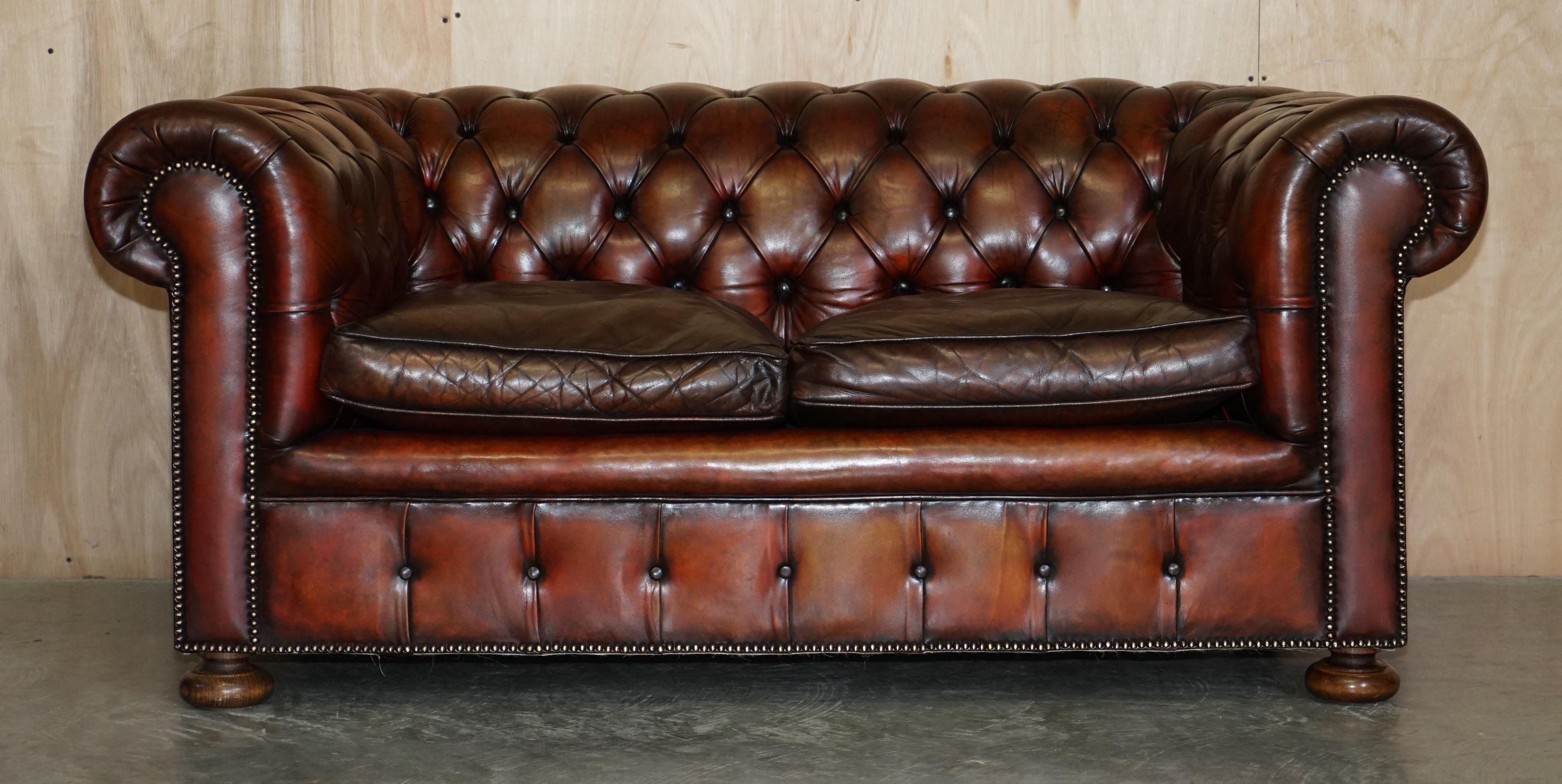 We are delighted to offer for sale this sublime pair of Antique, fully restored, hand dyed Boudreaux brown leather Chesterfield sofas with overstuffed feather filled cushions and solid walnut bun feet

Both sofas have been upholstered in premium