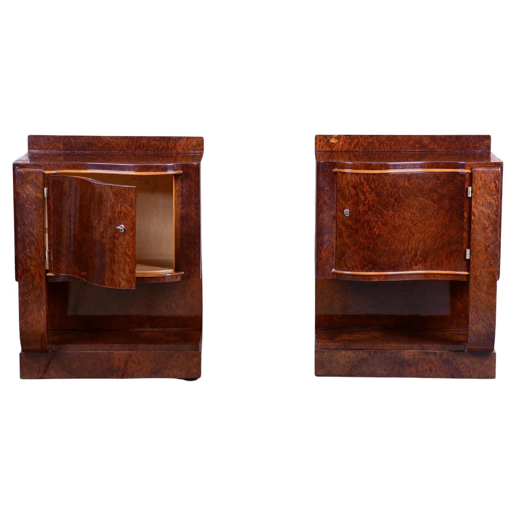 Exclusive pair of Art Deco bedside tables from the first half of the 20th century, originating from elegant France. These masterfully crafted tables are made from high-quality beech blockboard, enhanced with a precious thuja veneer that lends them a