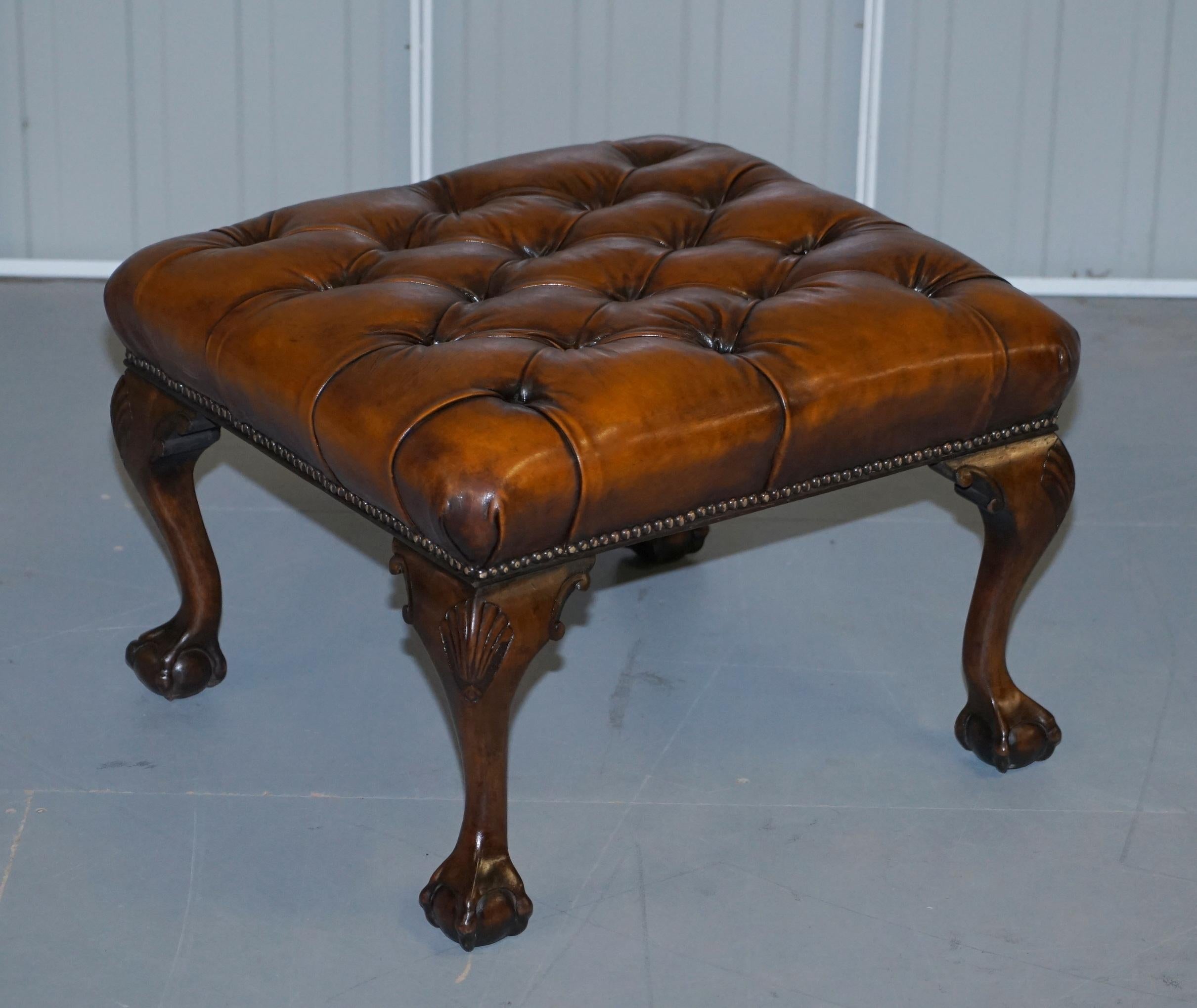 We are delighted to offer for sale this stunning pair of fully restored hand dyed cigar brown leather Chesterfield Hearth Ottoman Footstools with ornately carved claw & ball feet in the Georgian Irish style 

A very good looking and well made
