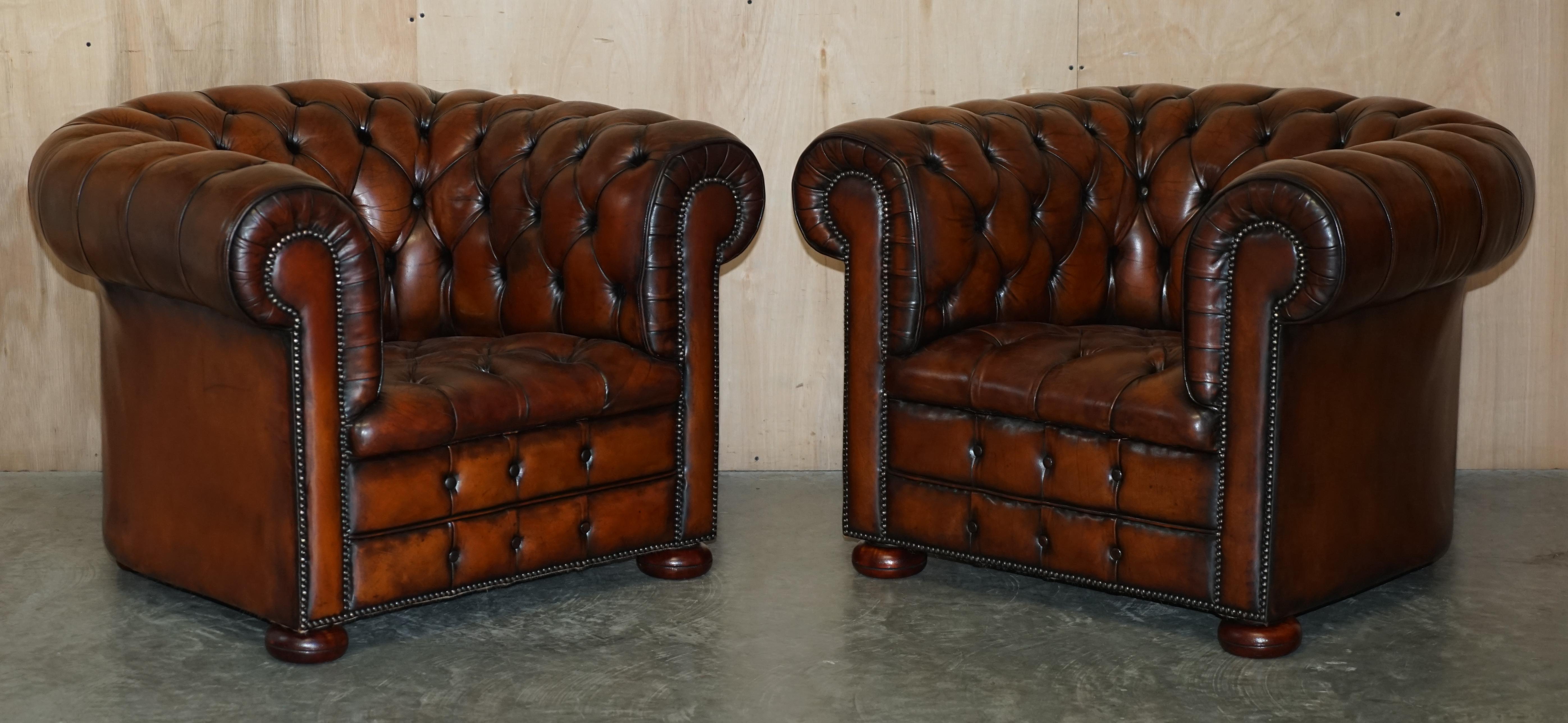 We are delighted to offer for sale this absolutely stunning pair of original circa 1930s Art Deco, super comfortable hand dyed saddle brown leather club armchairs and footstools with Chesterfield tufting

Please note the delivery fee listed is