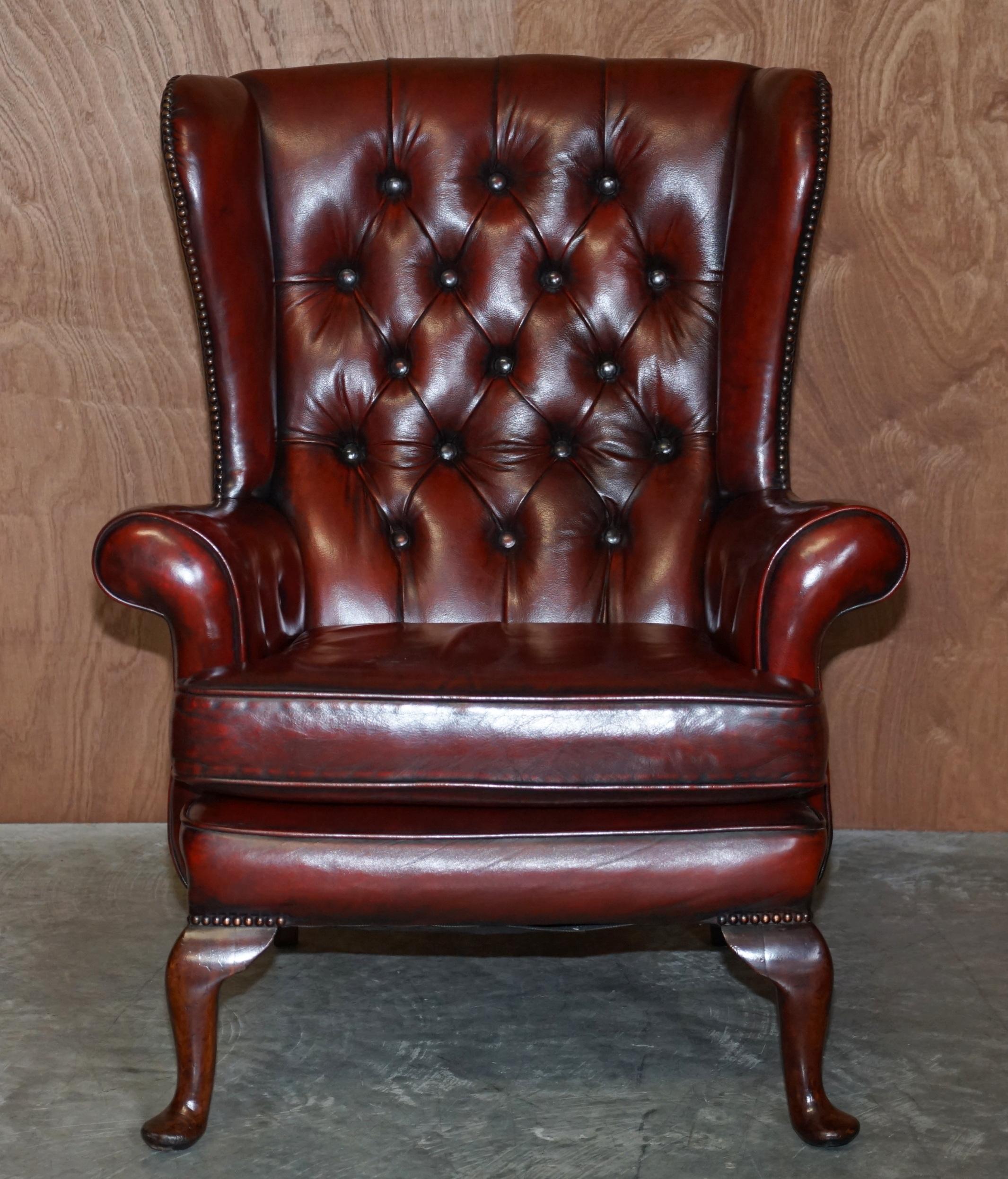 English Pair of Restored Chesterfield Wingback Bordeaux Leather Armchairs & Footstools