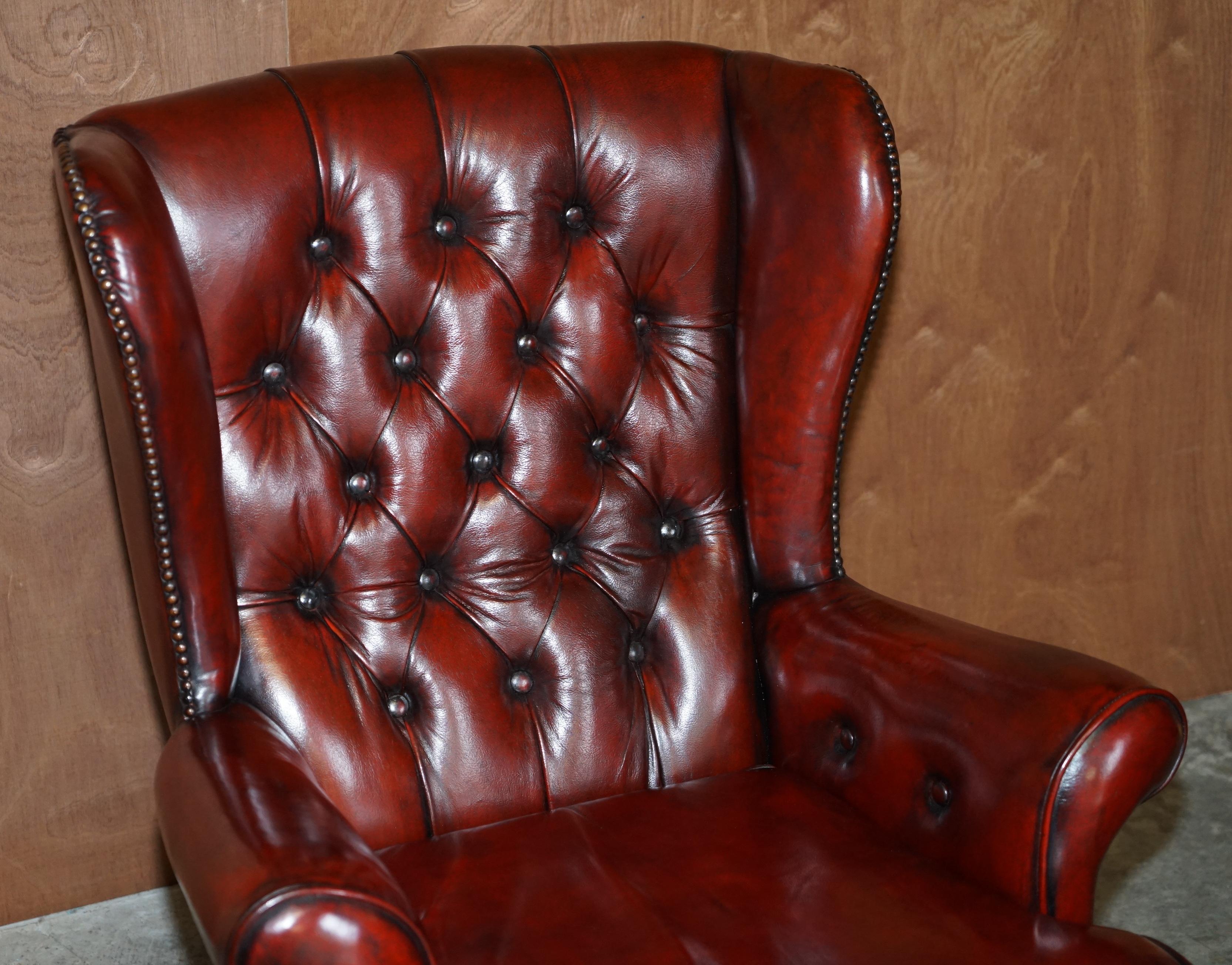 Hand-Crafted Pair of Restored Chesterfield Wingback Bordeaux Leather Armchairs & Footstools