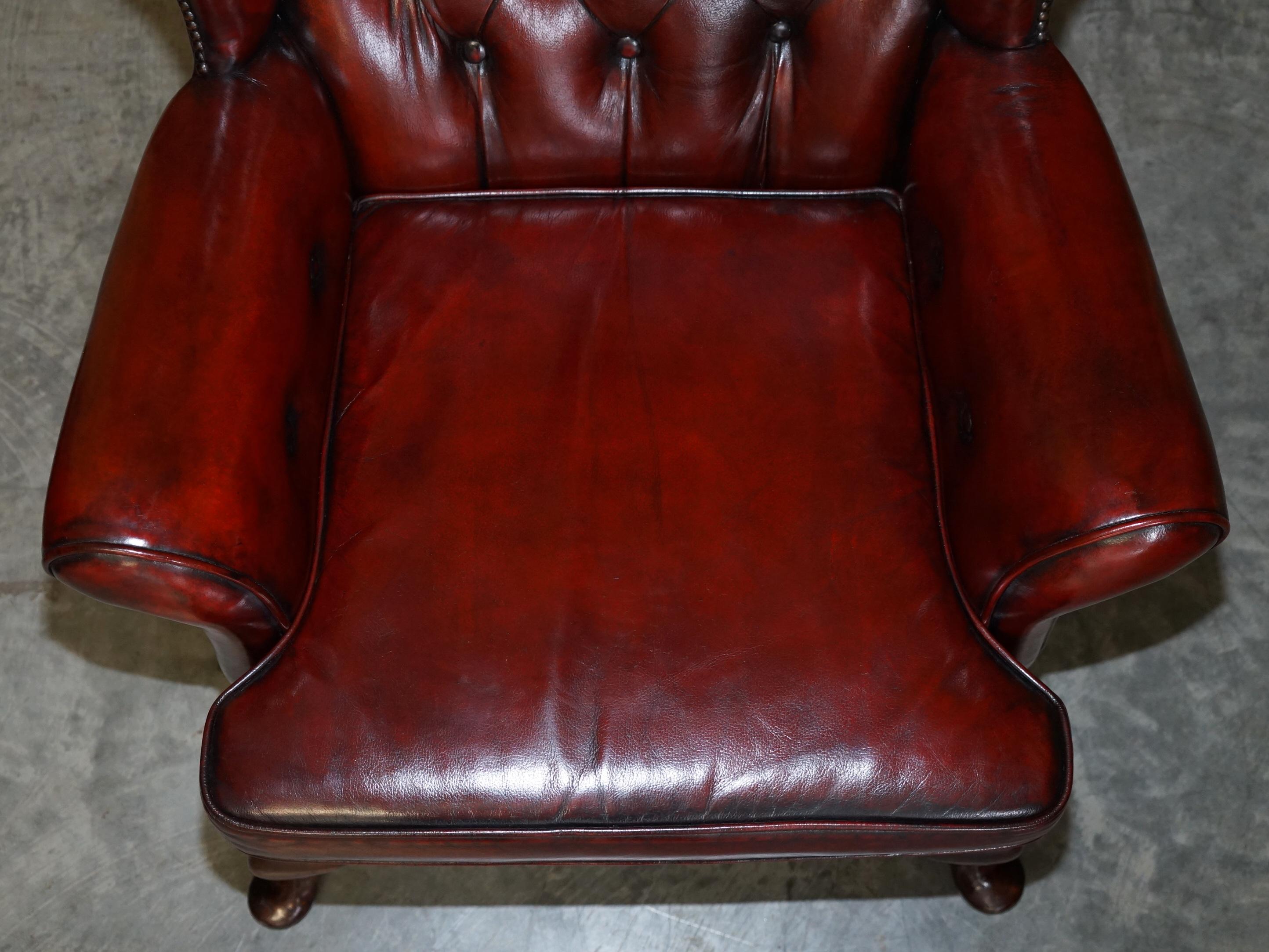 Pair of Restored Chesterfield Wingback Bordeaux Leather Armchairs & Footstools 1