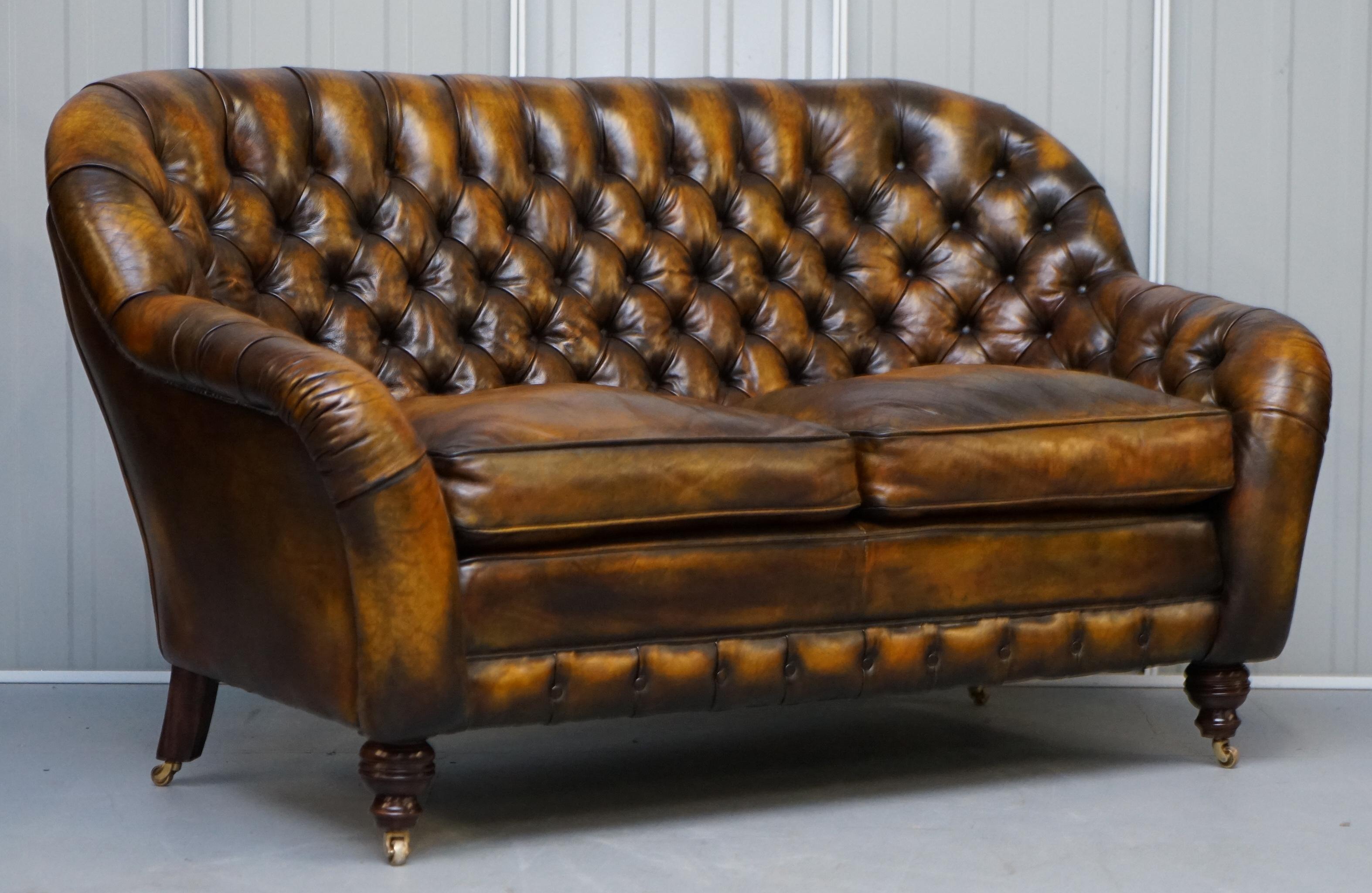 We are delighted to offer for sale this stunning pair of fully restored hand dyed Whisky brown leather Chesterfield two-seat sofas with feather filled cushions

A very good looking and well made pair of sofas, they have feather filled cushions,