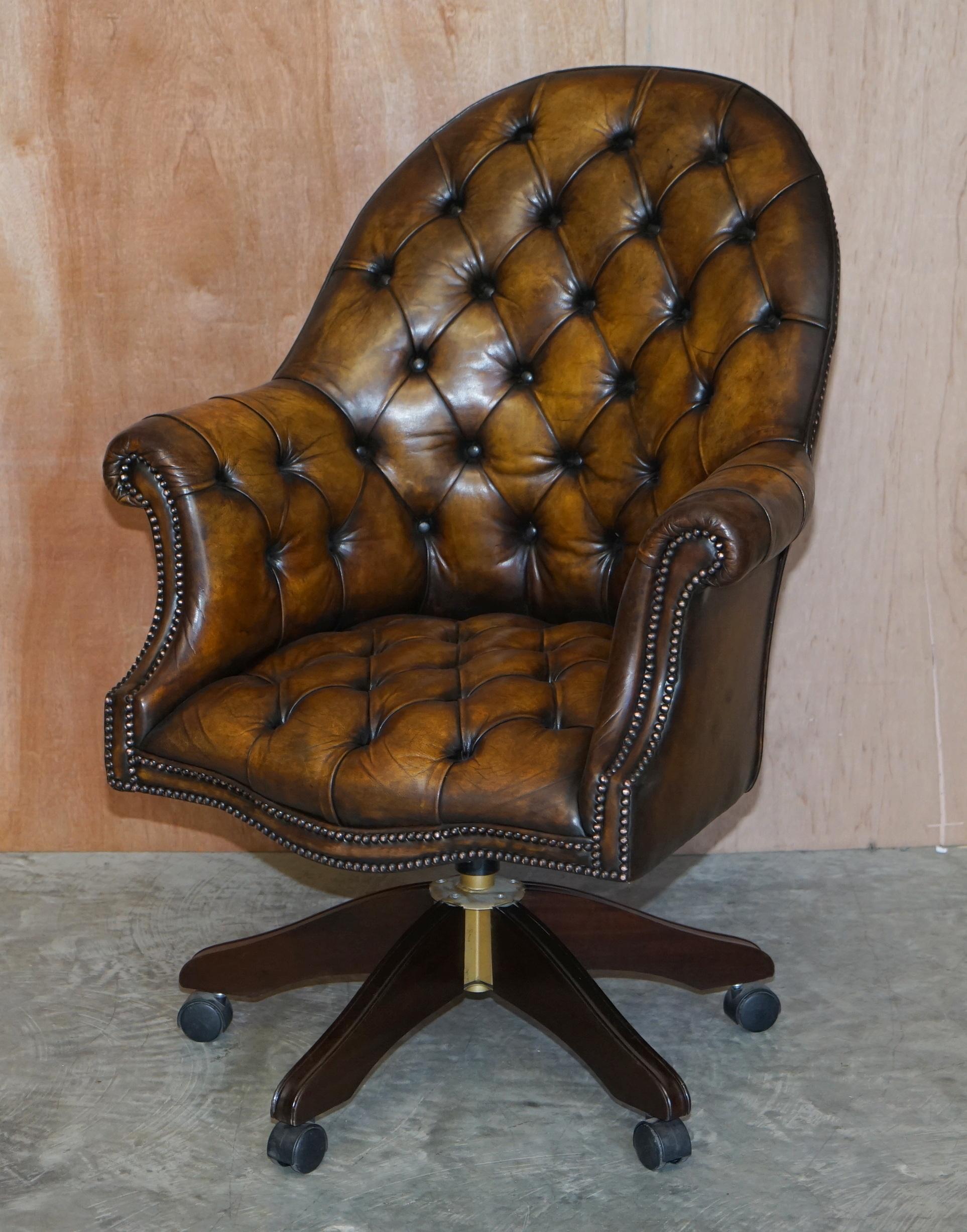 We are delighted to offer for sale this stunning pair of fully restored aged brown leather Godfather Directors armchairs

These are a very fine and well made English pair of circa 1940’s Directors chairs, they have coil sprung bases, Chesterfield