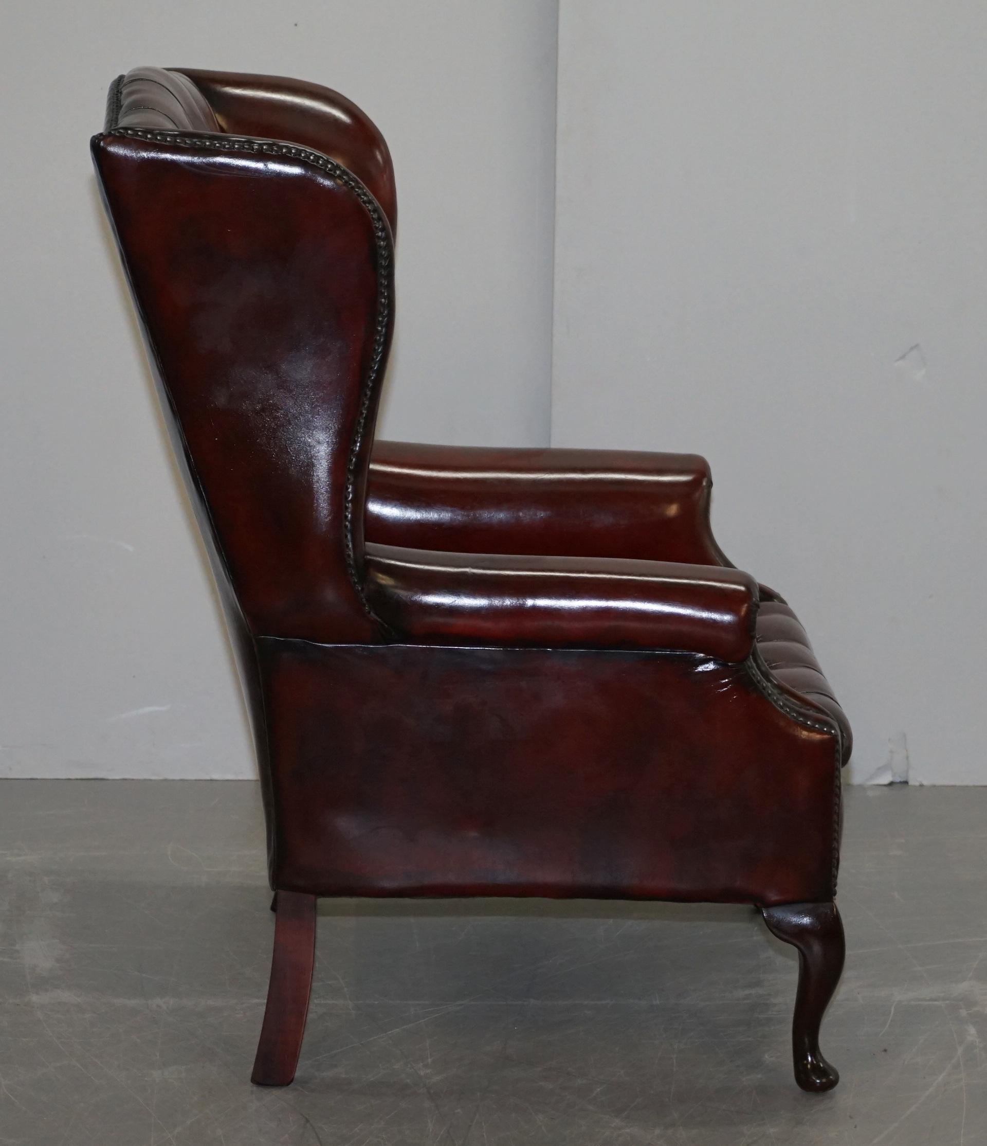Pair of Restored Oxblood Leather Fully Tufted Chesterfield Wingback Armchairs 1