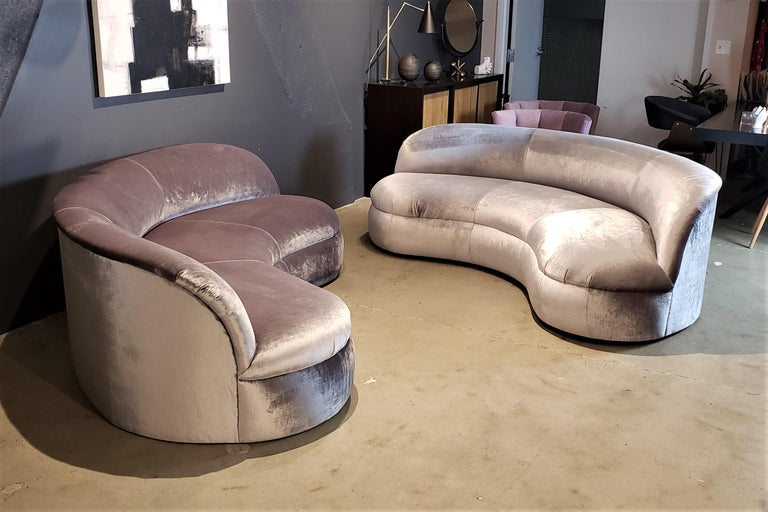 PRICED PER ITEM: Pair of biomorphic kidney form sofas for Directional Furniture, 1990s. Very comfortable and newly upholstered in a shimmery silver velvet. Fully restored with all new foam--pristine condition. Elegant, clean lines and a sleek
