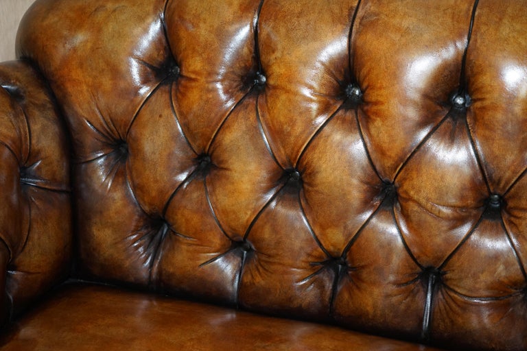 Mahogany Pair of Restored Victorian Gentleman's Tufted Chesterfield Brown Leather Sofas For Sale