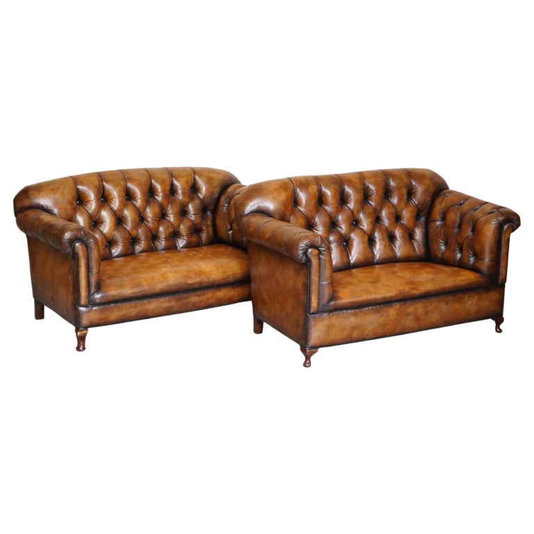 Pair of Restored Victorian Gentleman's Tufted Chesterfield Brown Leather Sofas For Sale