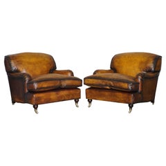 Paire de fauteuils vintage restaurés en cuir brun cigare George Smith Howard
