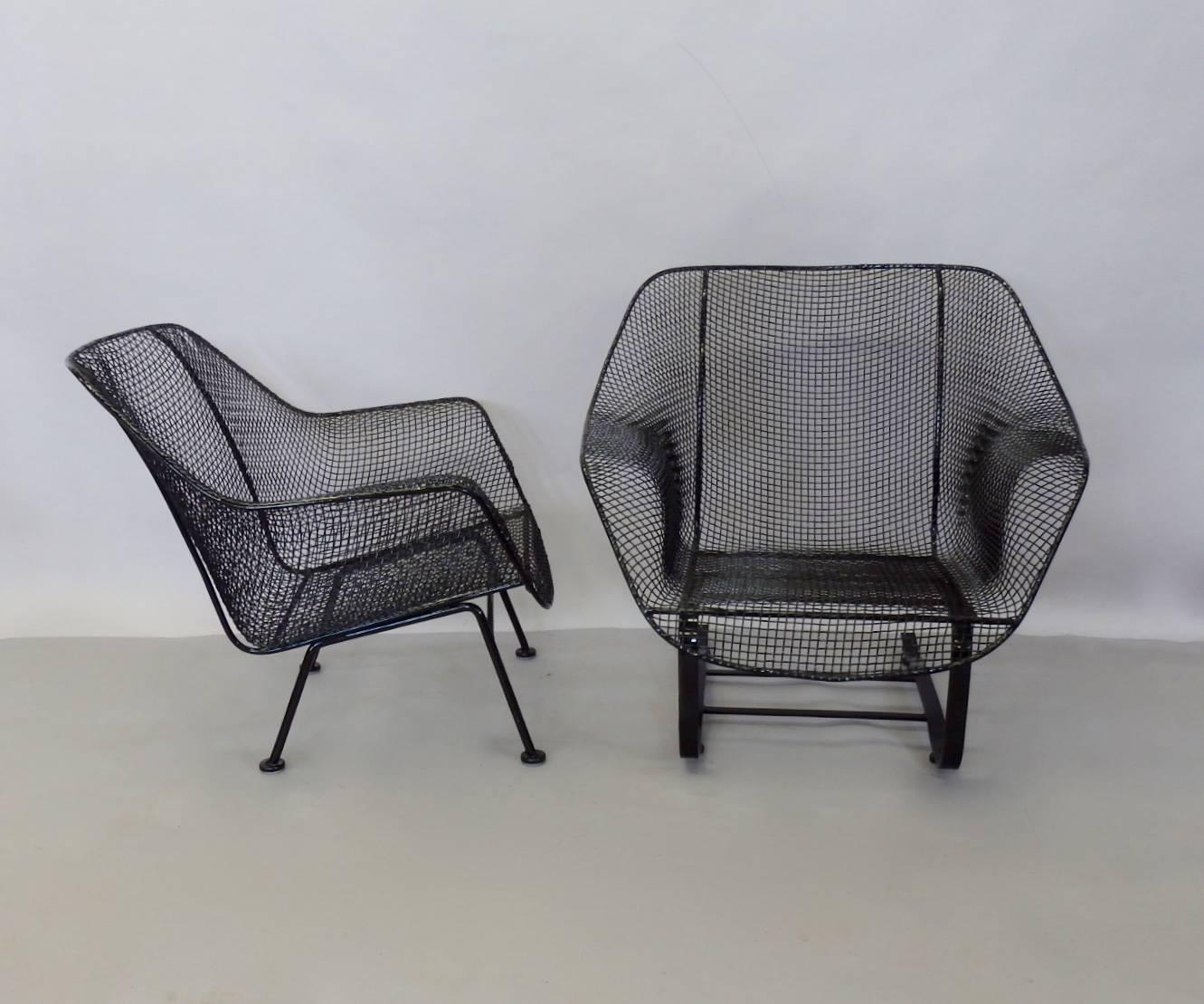 Pair of Woodard large lounge chairs. One springer base one straight leg. Both chairs recently stripped and powder coated in gloss black finish. New glides added to each base.