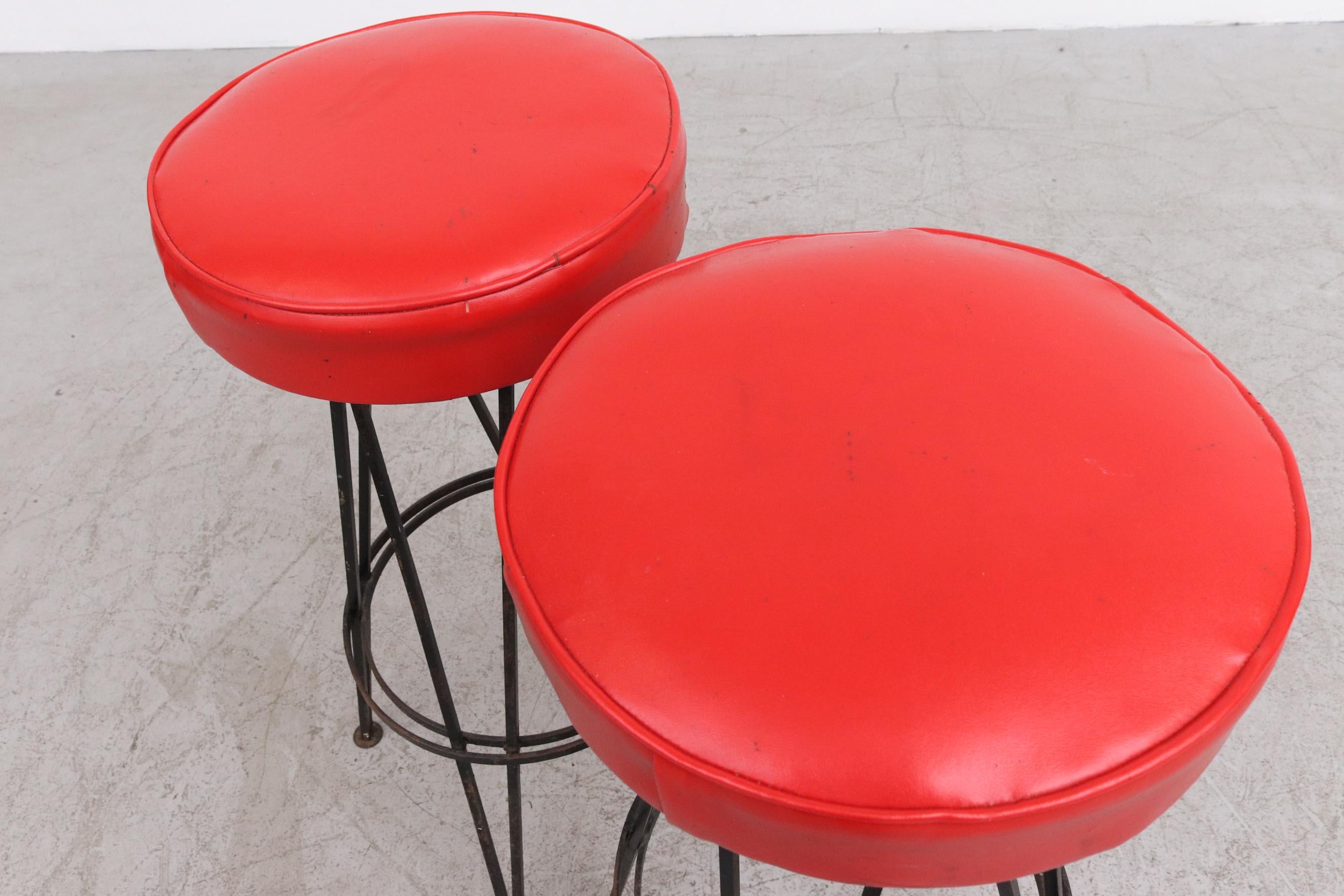 Mid-Century Modern Pair of Retro 50's Round Red Skai Bar Height Stools with Black Base and Legs For Sale