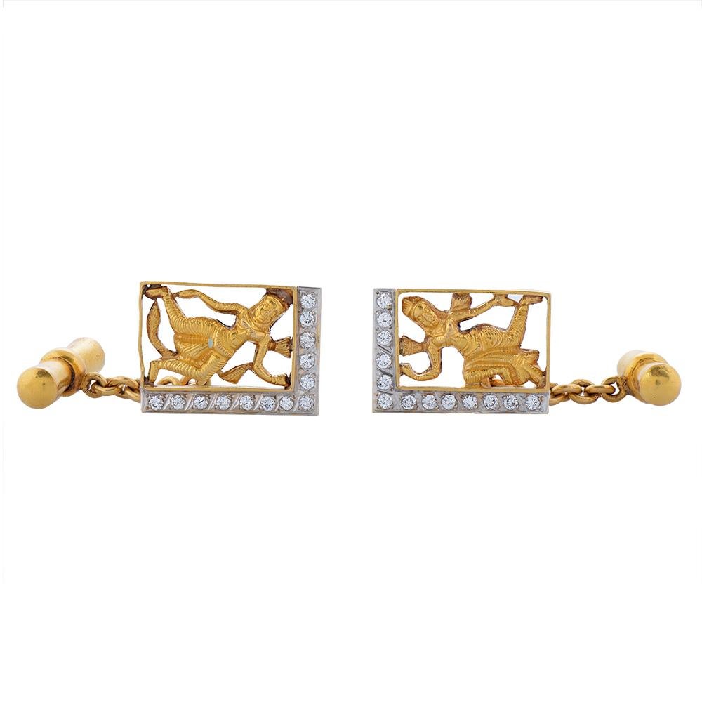 Pair of mid-century gold and diamond gentleman's cufflinks. Each designed as an openwork, rectangular panel depicting an Indian deity, decorated with two rows of brilliant-cut diamonds. Circa 1950s.