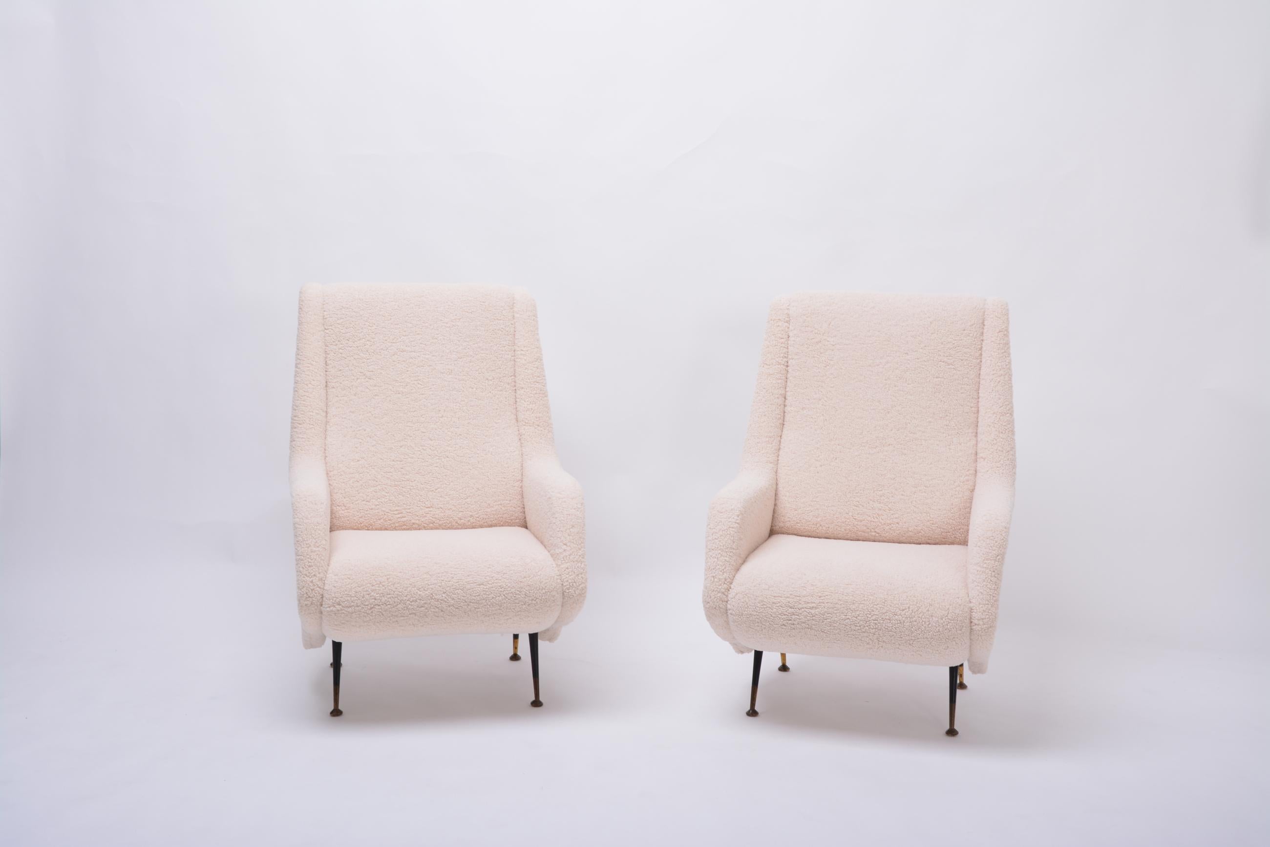 Pair of reupholstered mid-century Italian armchairs in the style of A. Morbelli

Pair of beige reupholstered Mid-Century Modern Italian armchairs in faux teddy fur in the style of Aldo Morbelli. These chairs were produced in Italy in the 1950s and