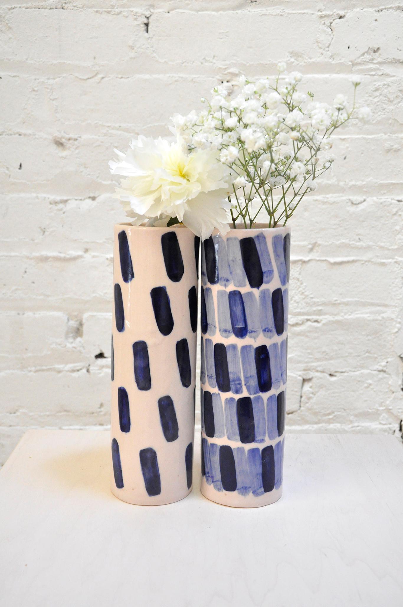 Hand-built porcelain vases by Isabel Halley, in hand-dyed ballet pink with striking cobalt glaze brush strokes.

Dimensions: 8