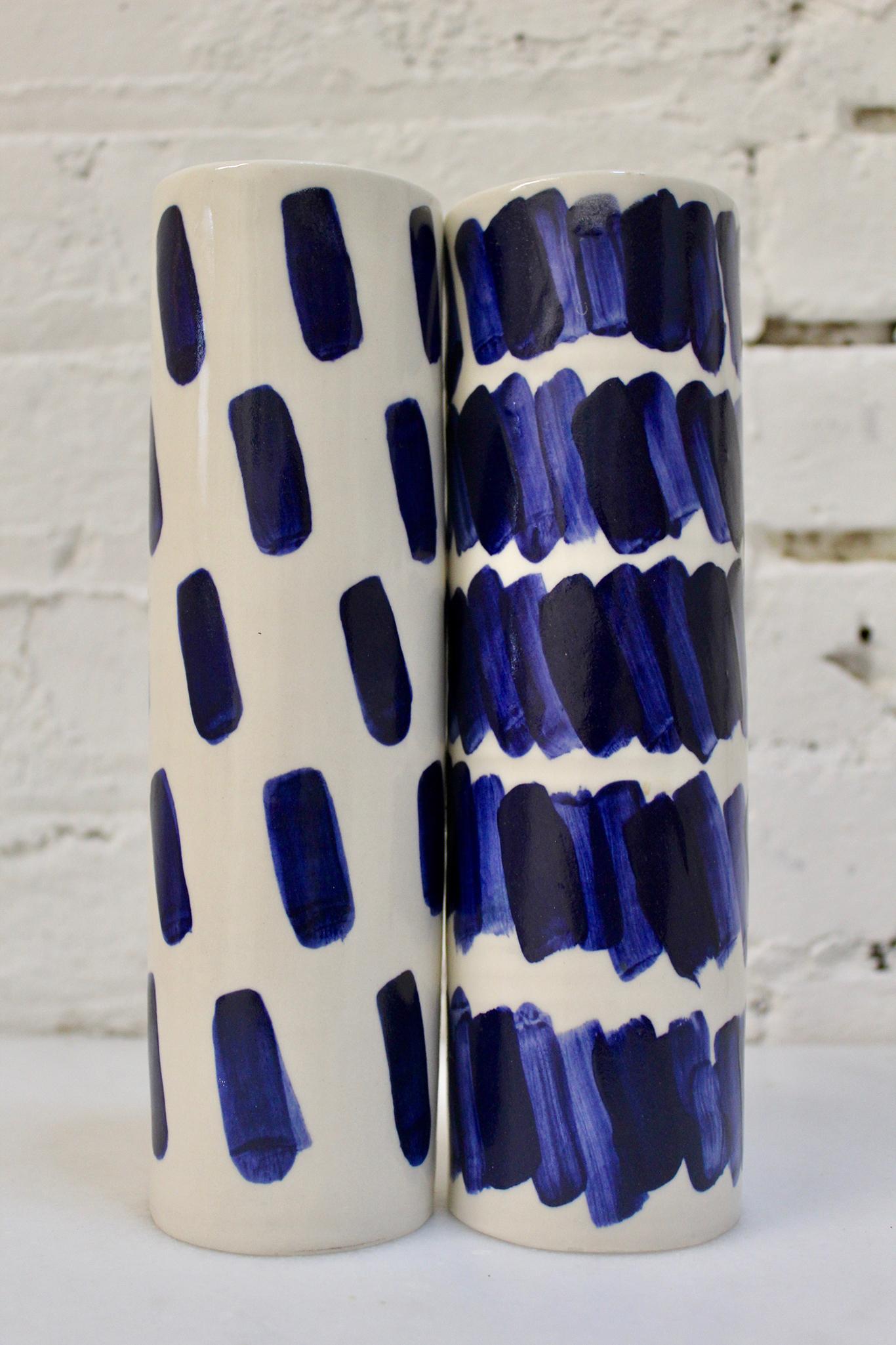 Hand-built vases by Isabel Halley, in creamy white porcelain with striking cobalt glaze brush strokes.

Dimensions: 8