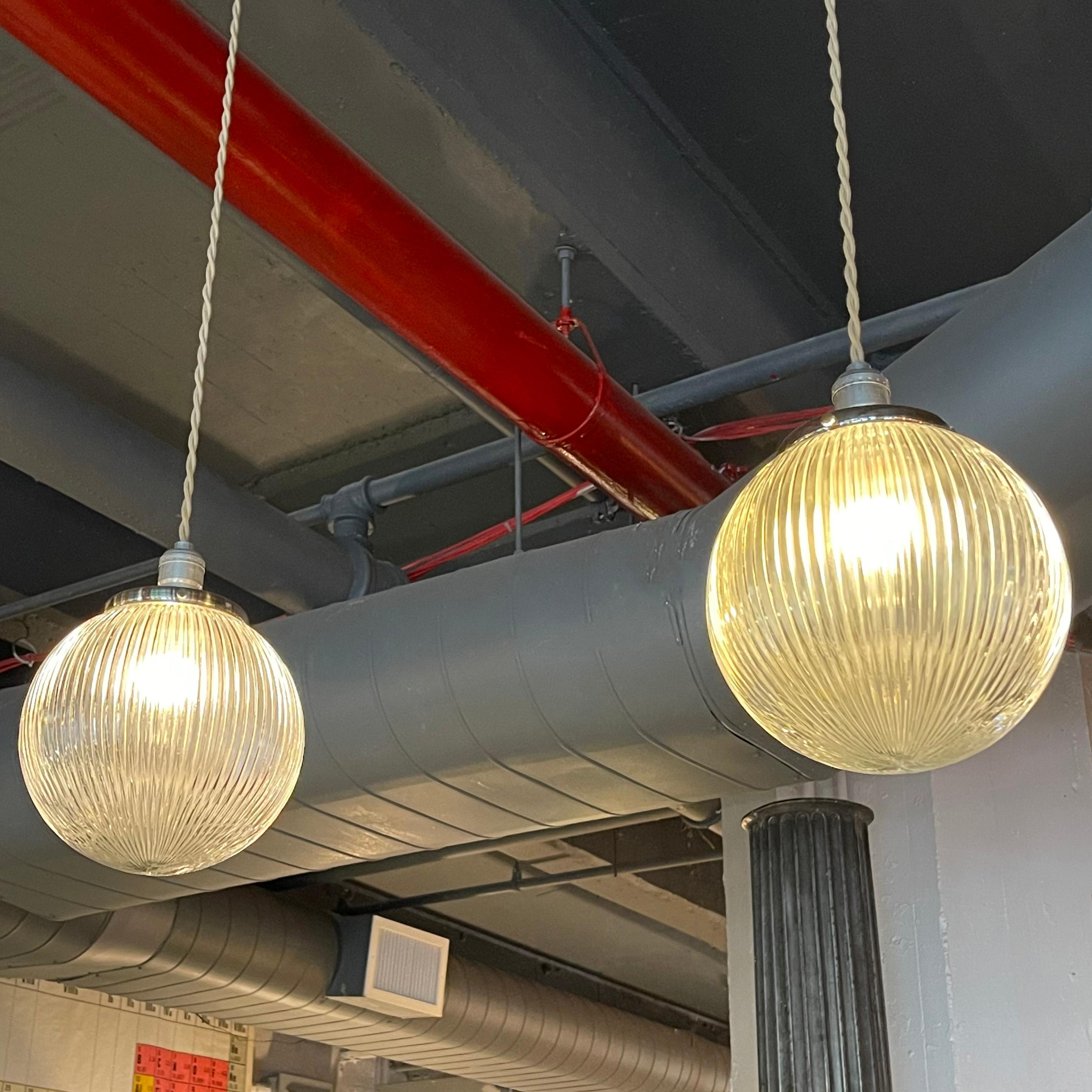 American Pair of Ribbed Glass Globe Pendant Lights