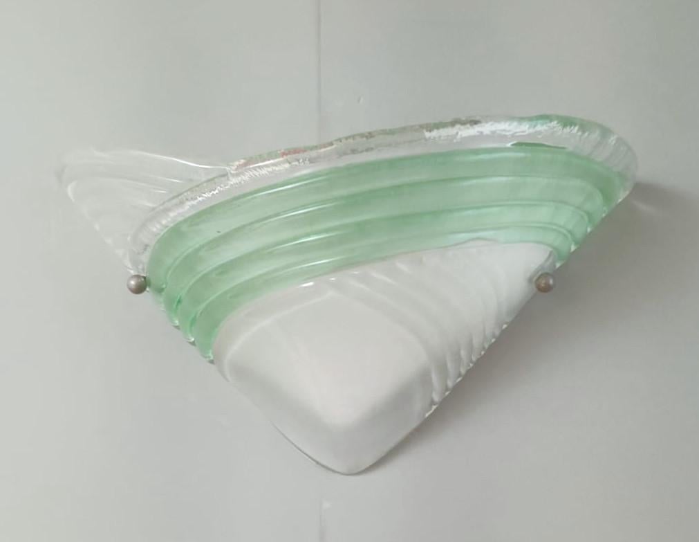 Vintage pair of Italian wall lights with frosted white Murano glass shades and green ribbed band / Made in Italy in the style of Mazzega, circa 1960s
Height 8 inches, width 15 inches, depth 7 inches
1 light / E12 or E14 type / max 40W
Pair available