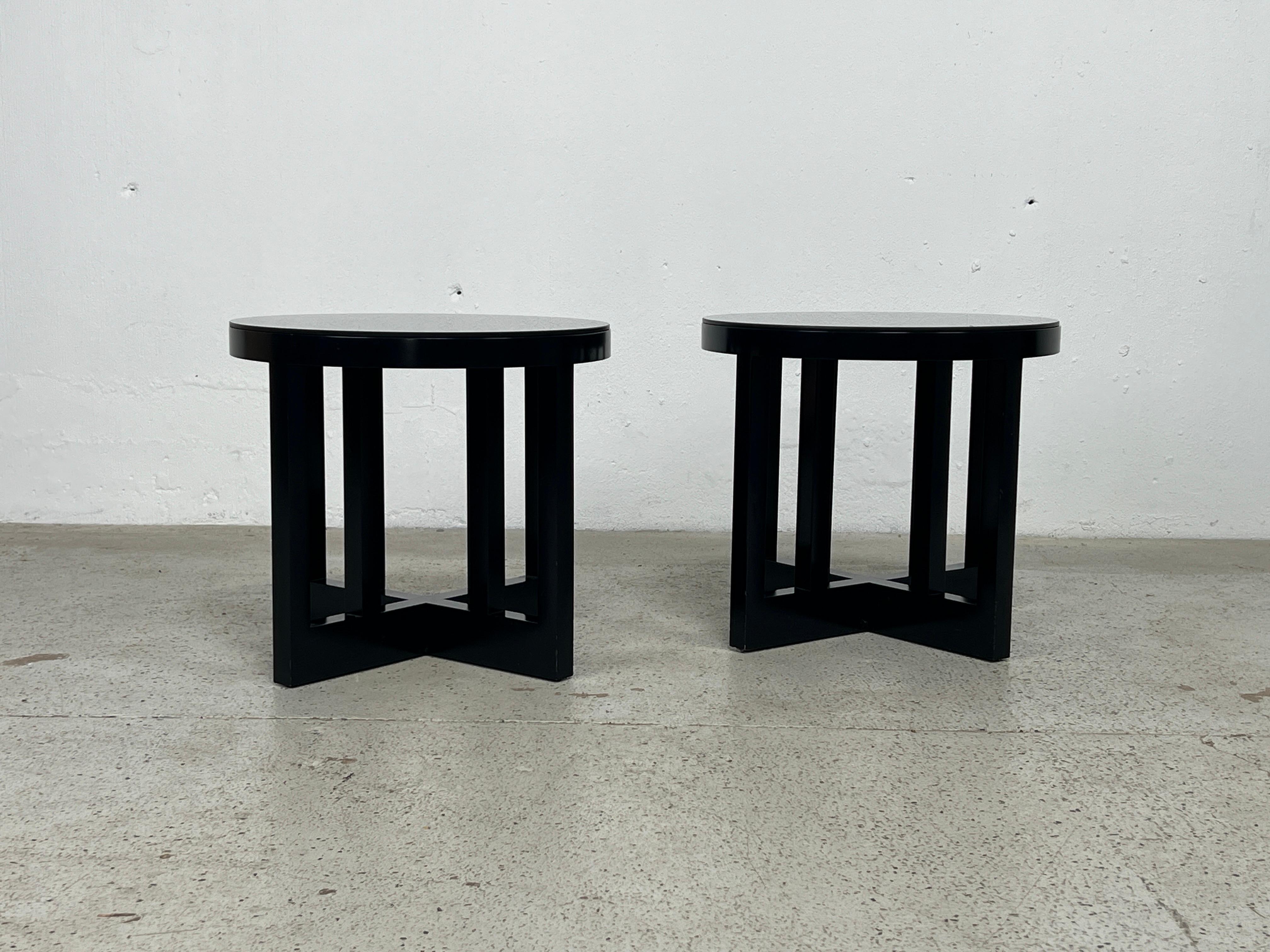 A pair of black lacquered stools designed by Richard Meier for Knoll, 1982. Original condition with custom black glass tops. 