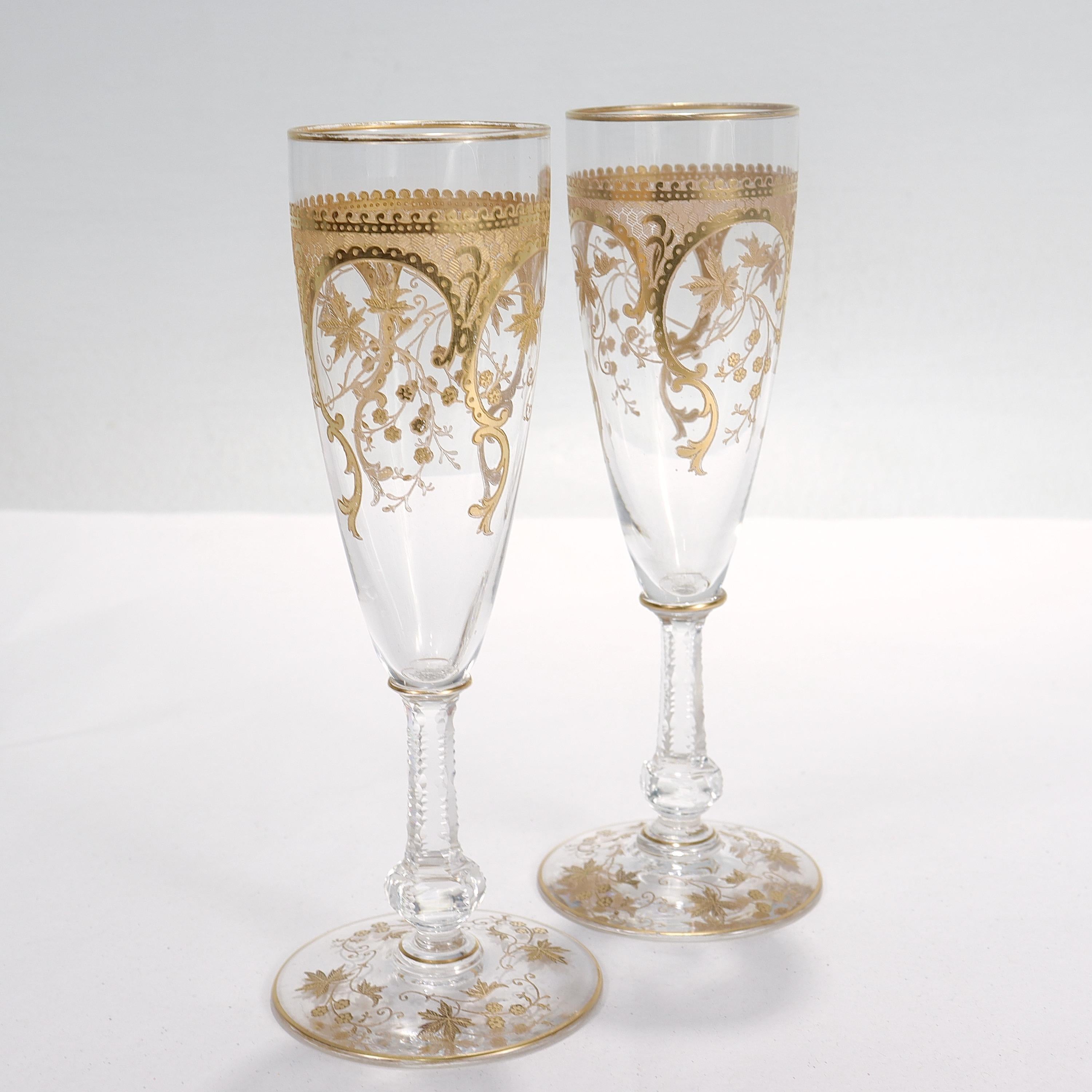 A pair of very fine old or antique champagne stems or flutes.

In molded and cut glass with finely etched & richly gilt flower & vine trellis fretwork designs throughout.

(In the Baccarat or Saint Louis Style).

Perfect for the special