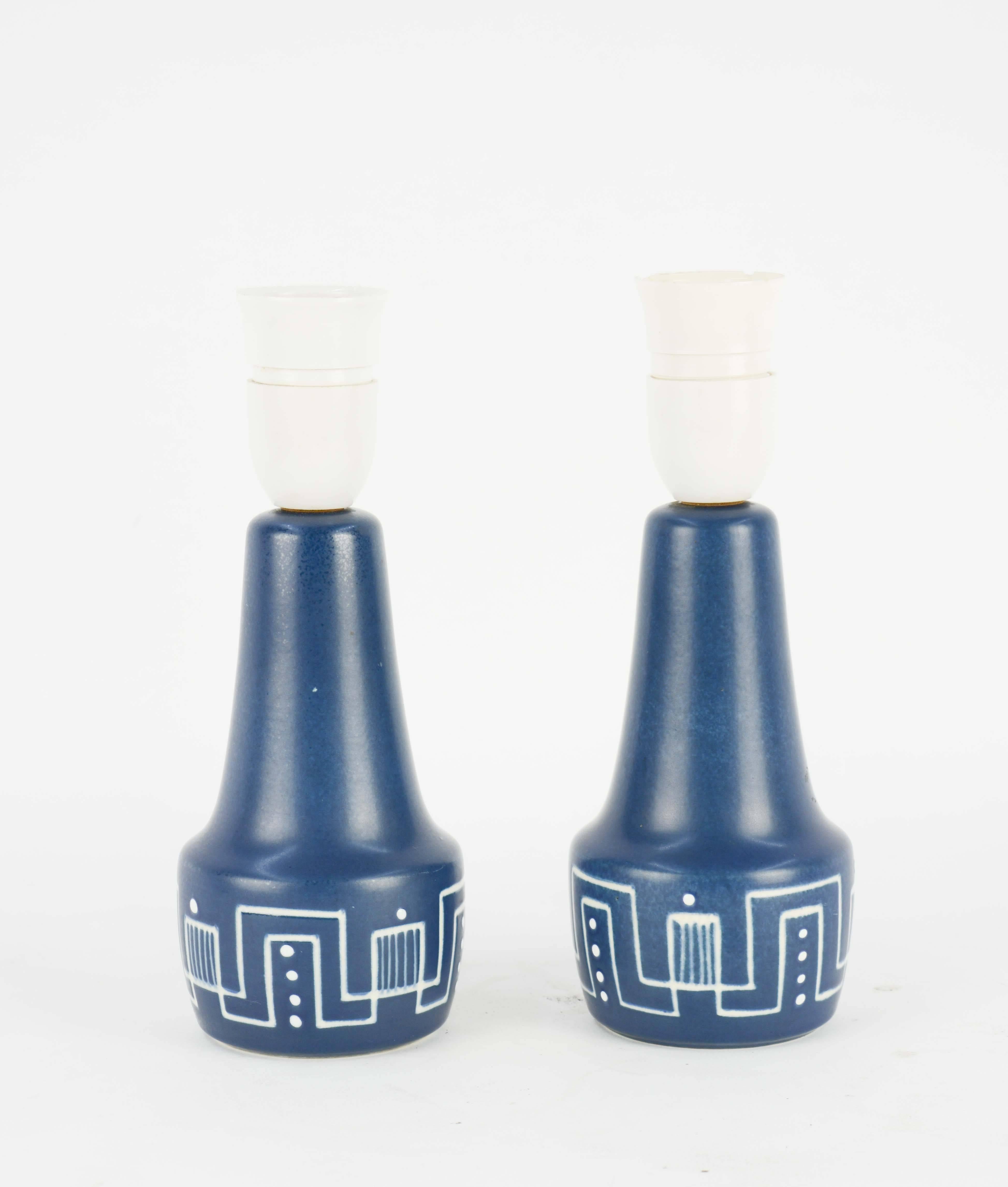 A wondersul blue glaze and etched design pattern on these Rigmor Nielsen lamps for Soholm Stentj of Denmark. They are sold without shades and can be rewired for an additional cost.