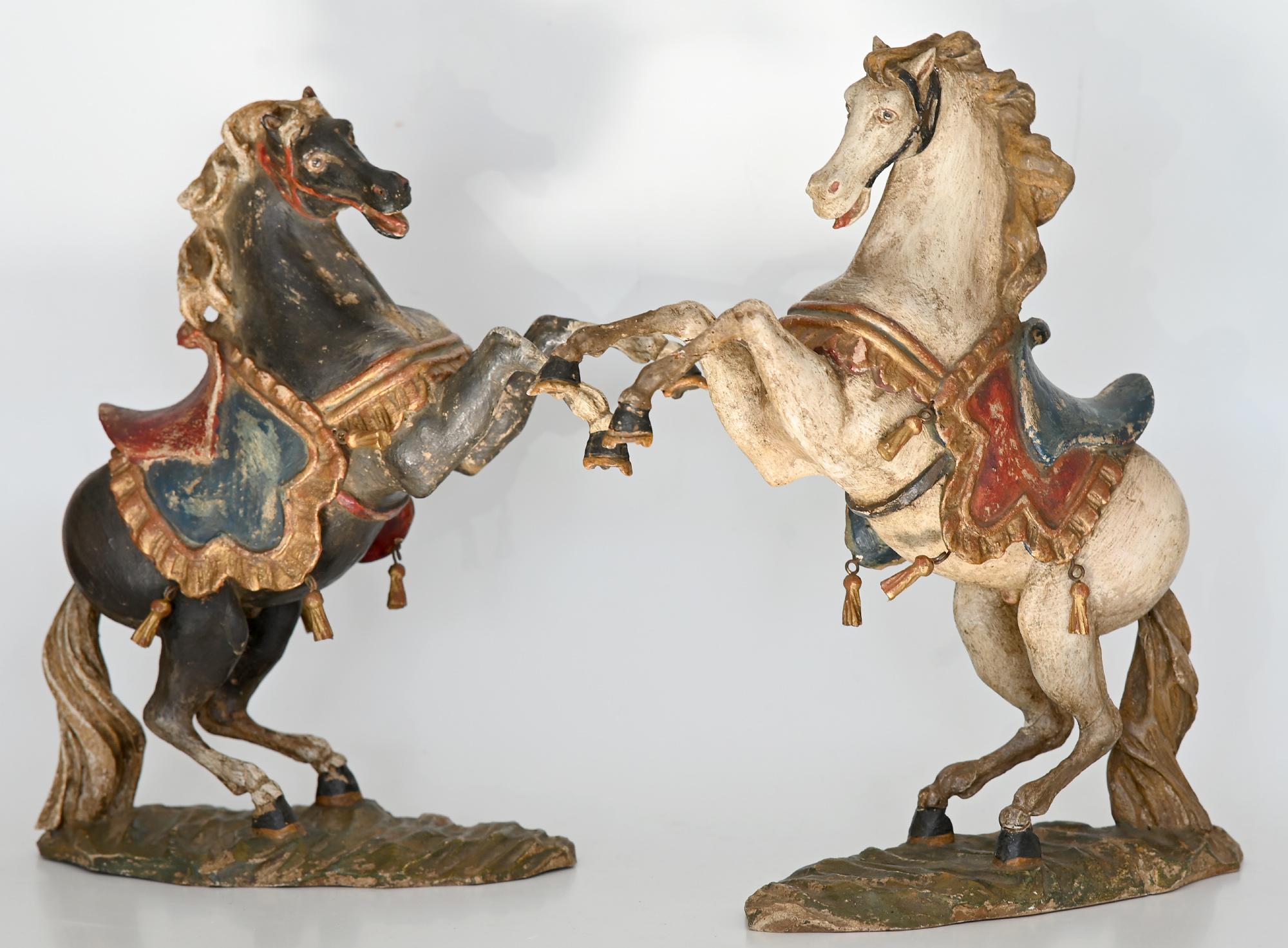 A very nice pair of rising horses, made out of carved wood. The beautiful pair was made circa 1930 in Oberammergau, Bavaria, which is very famous due to the great history of carving in this town. The past of Oberammergau, near the Alps, still
