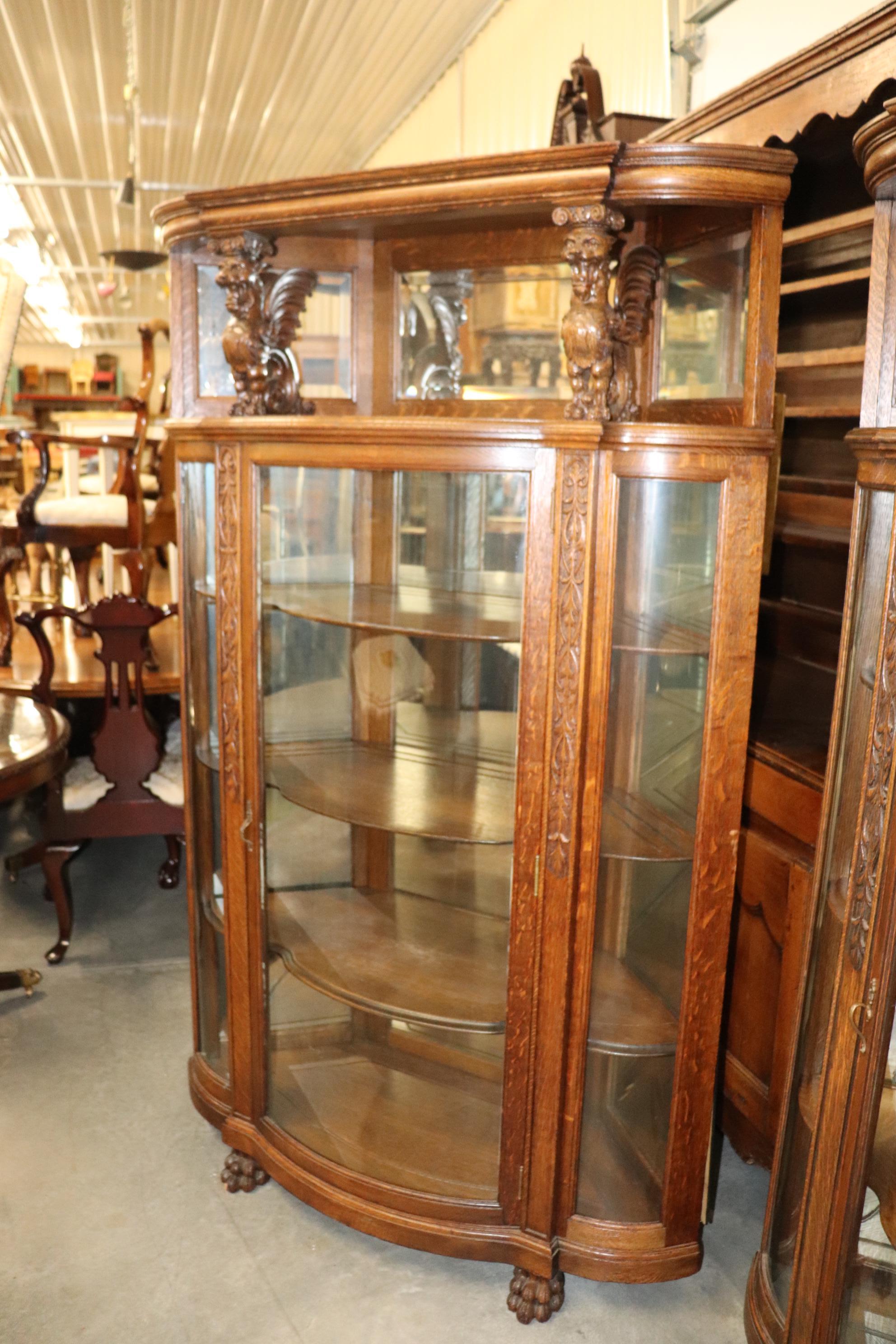 High Victorian Pair of R.J. Horner Carved Oak Mirrored Griffin Corner China Cabinets Cupboards