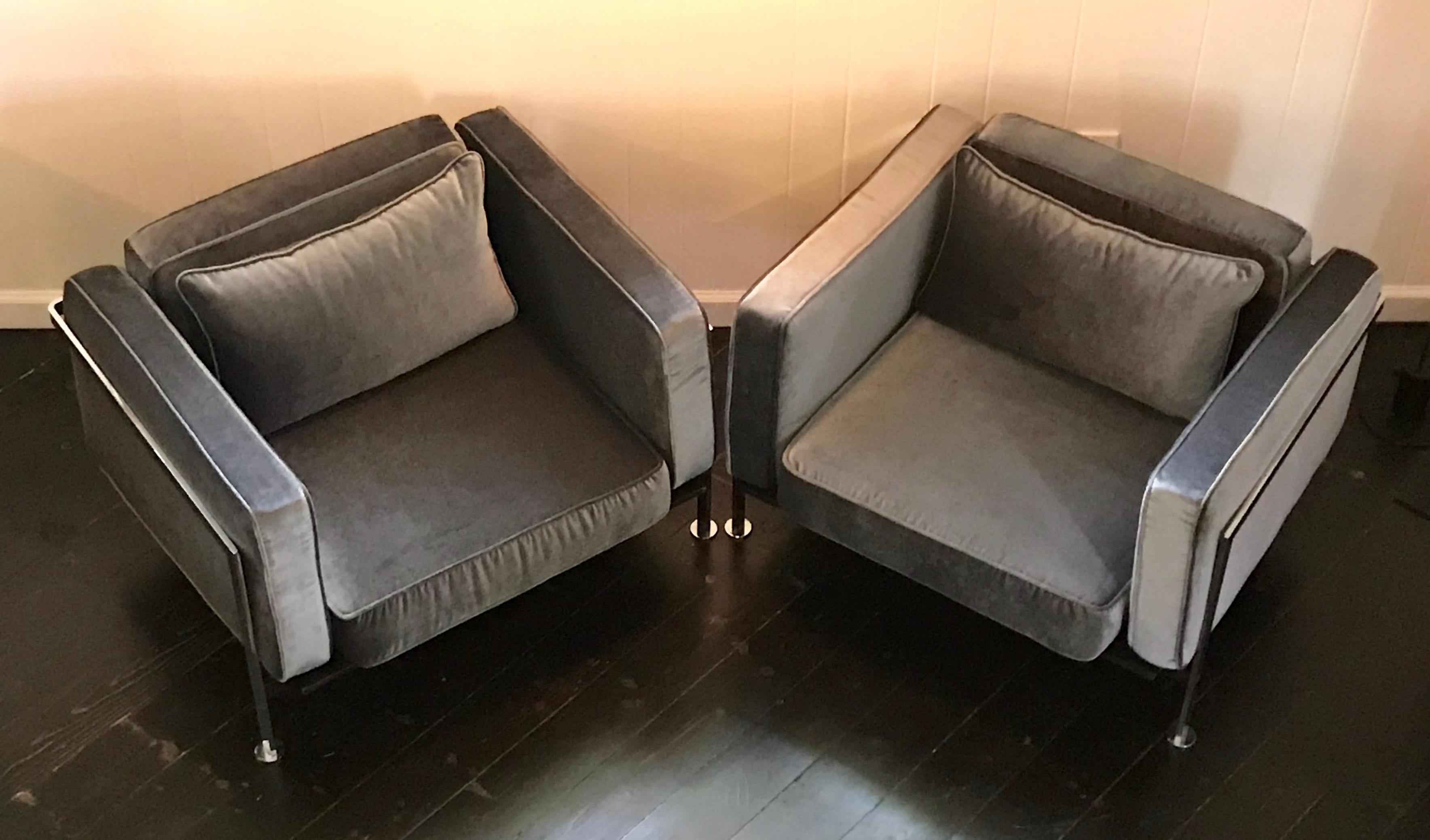 Fantastic pair of chrome lounge chairs by Robert Haussmann. Reupholstered in slate gray velvet, new webbing on seat frames. Come with additional seat cushion but we like them without, very chic.