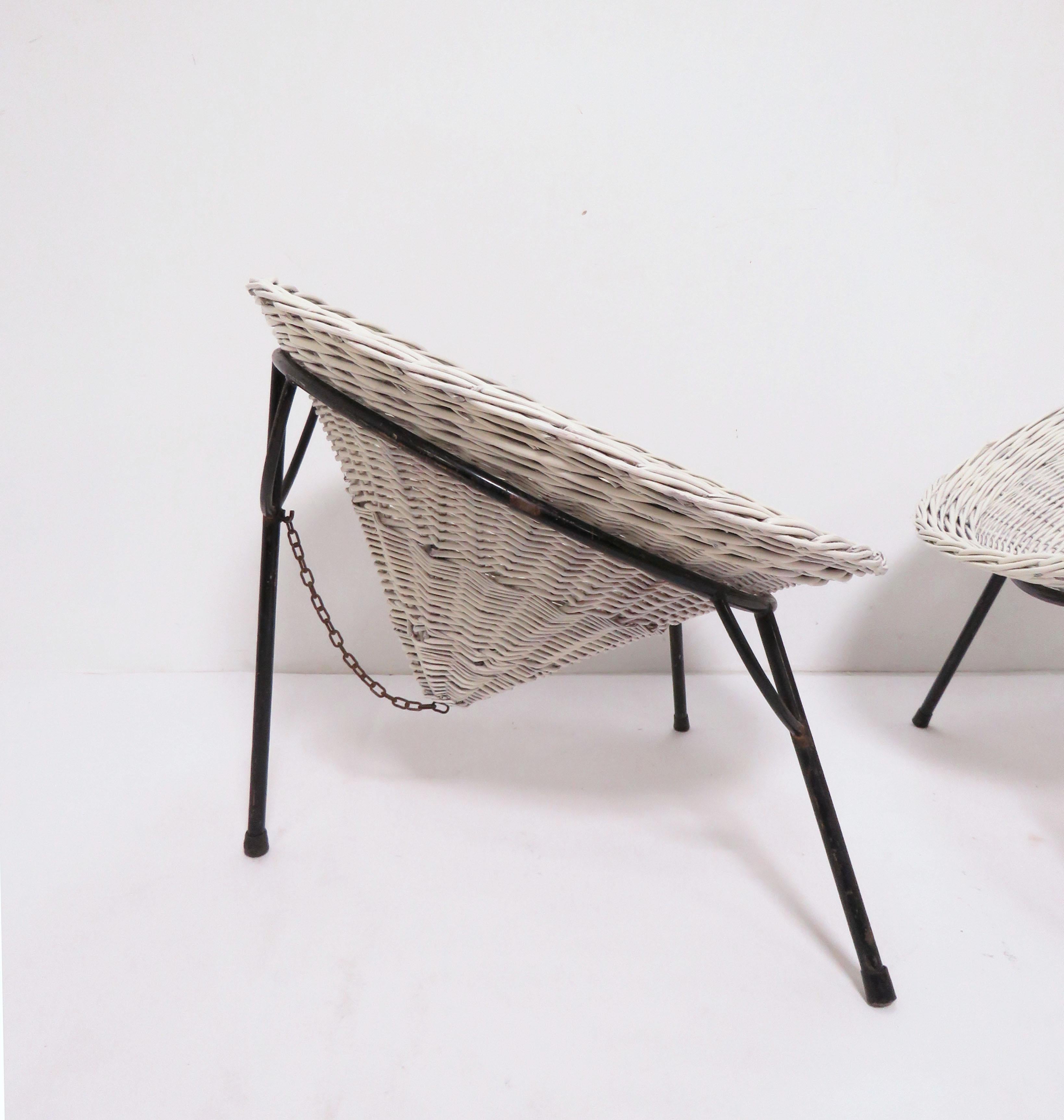 A pair of conical wicker “Sunflower” chairs by architect Roberto Mango for Tecno and imported to the US by Allan Gould Designs. Founded in 1953, Tecno was one of the most important companies to advance the global postwar fascination with Italian