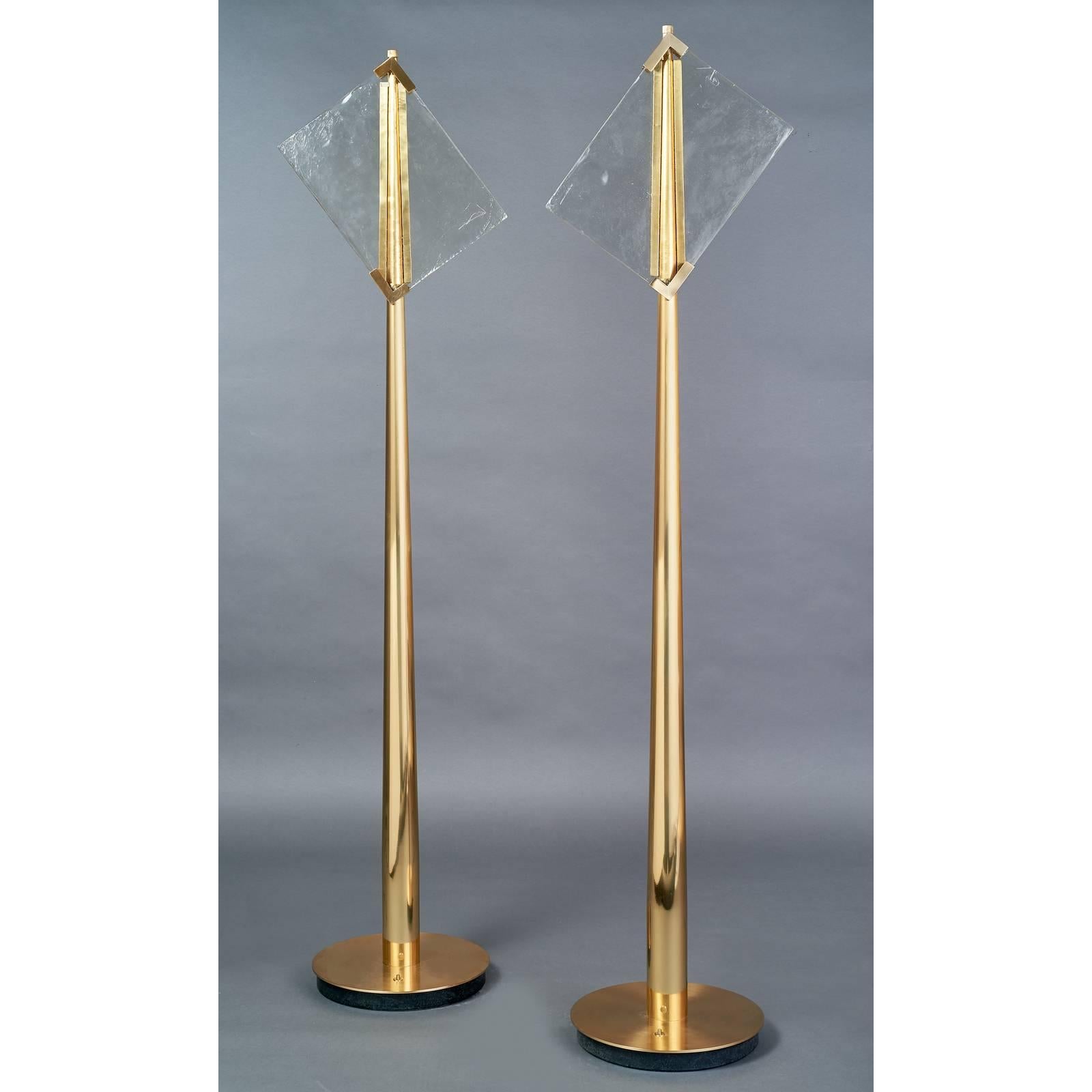 Roberto Rida ( b. 1943 )
A majestic and unique pair of standing lamps by Roberto Rida, each lamp featuring a pair of vintage Venini glass panels backlit with LED,
raised on two 6.5 foot brass tapering columns.
The  clear glass panels are signed