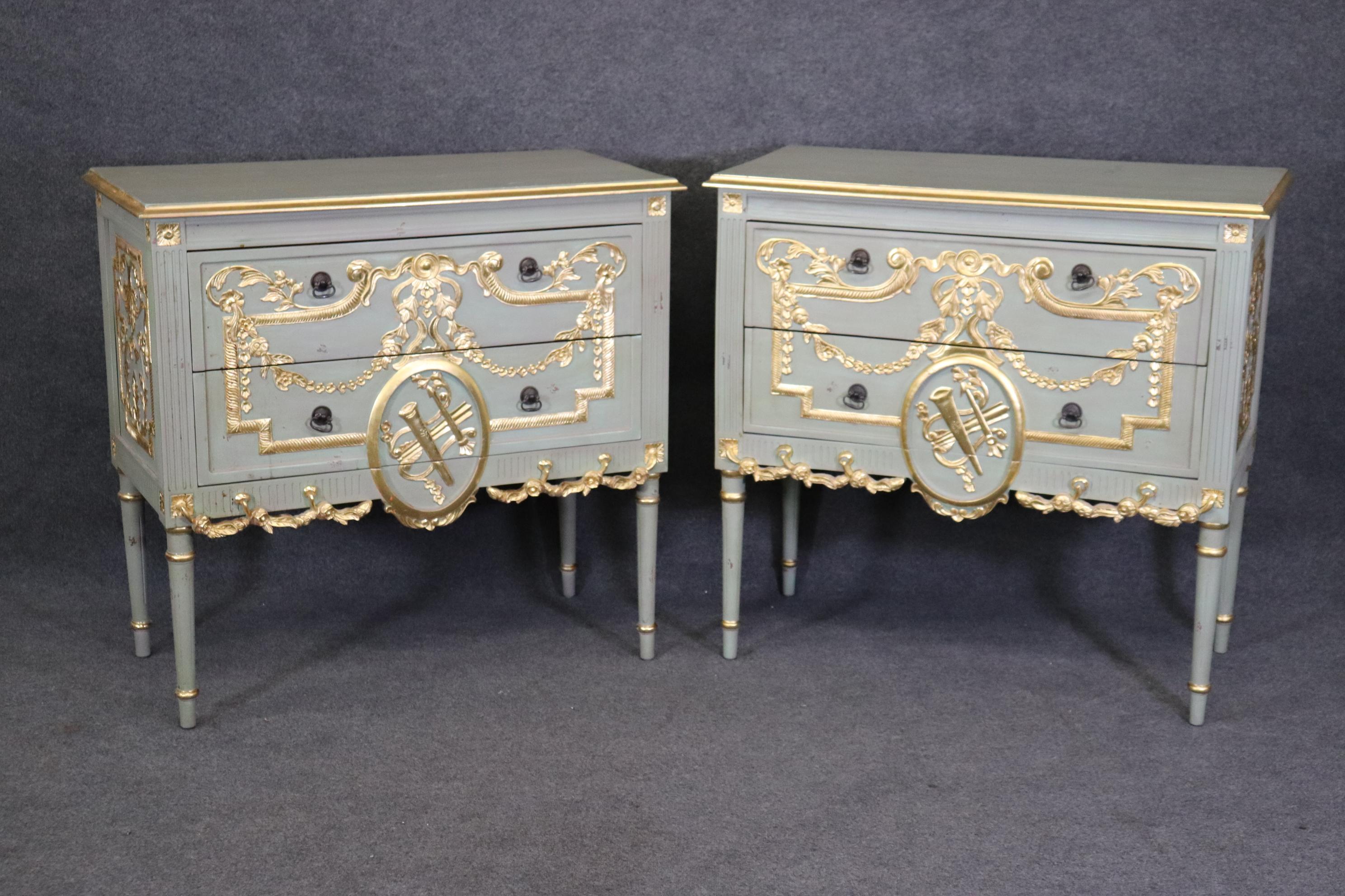 This is a flamboyant pair of bright gold leaf gilded Robin's egg blue distressed finish commodes. The gold is newer and the painted finish probably is too. There are some minor defects that will show as they are used such as a visible cup ring, but