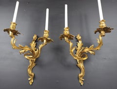 Pair Of Rocaille Wall Lights In Gilt Bronze