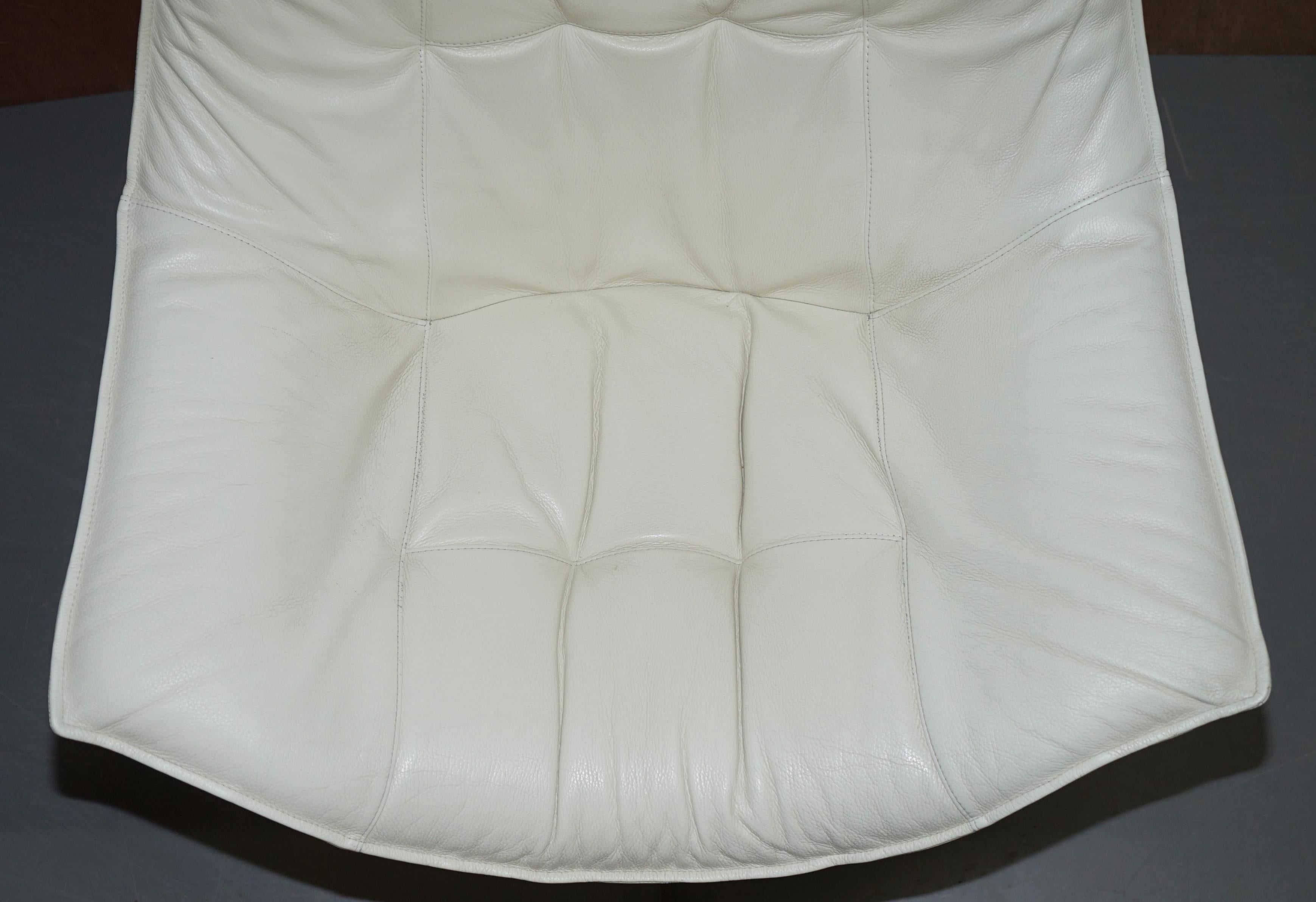 Pair of Roche Bobois Flight Swivel Cream Leather Armchairs and Ottomans In Good Condition In West Sussex, Pulborough
