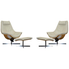 Vintage Pair of Roche Bobois Flight Swivel Cream Leather Armchairs and Ottomans