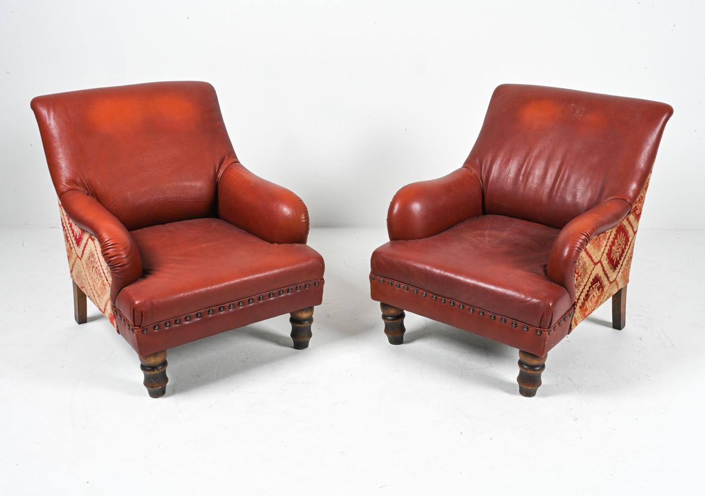 Behold the epitome of vintage luxury with this splendid pair of Roche Bobois lounge chairs—a testament to unparalleled craftsmanship and timeless design. Draped in a deep brick-red, these chairs showcase the robust beauty of treated buffalo leather
