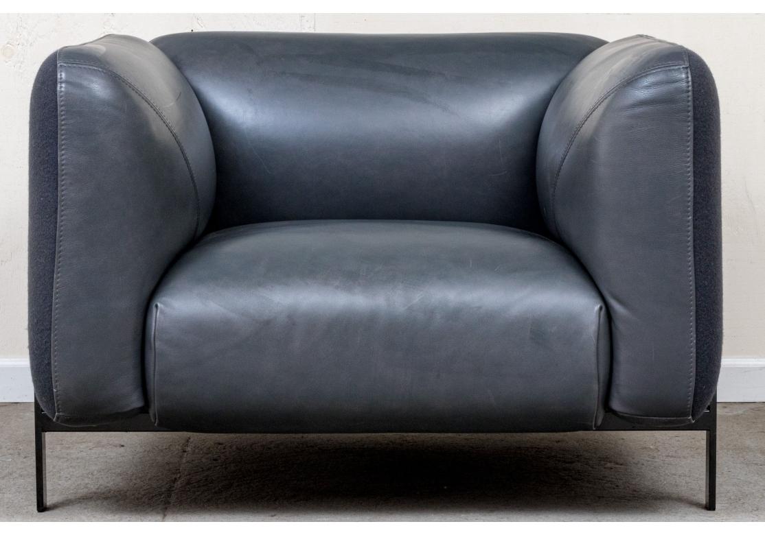 Made in Italy by Polaris in the finest construction expected from Roche Bobois. With charcoal gray full grain aniline finish leather back and tall arms over the black metal and plywood frames. The sides and backs are upholstered in complementary