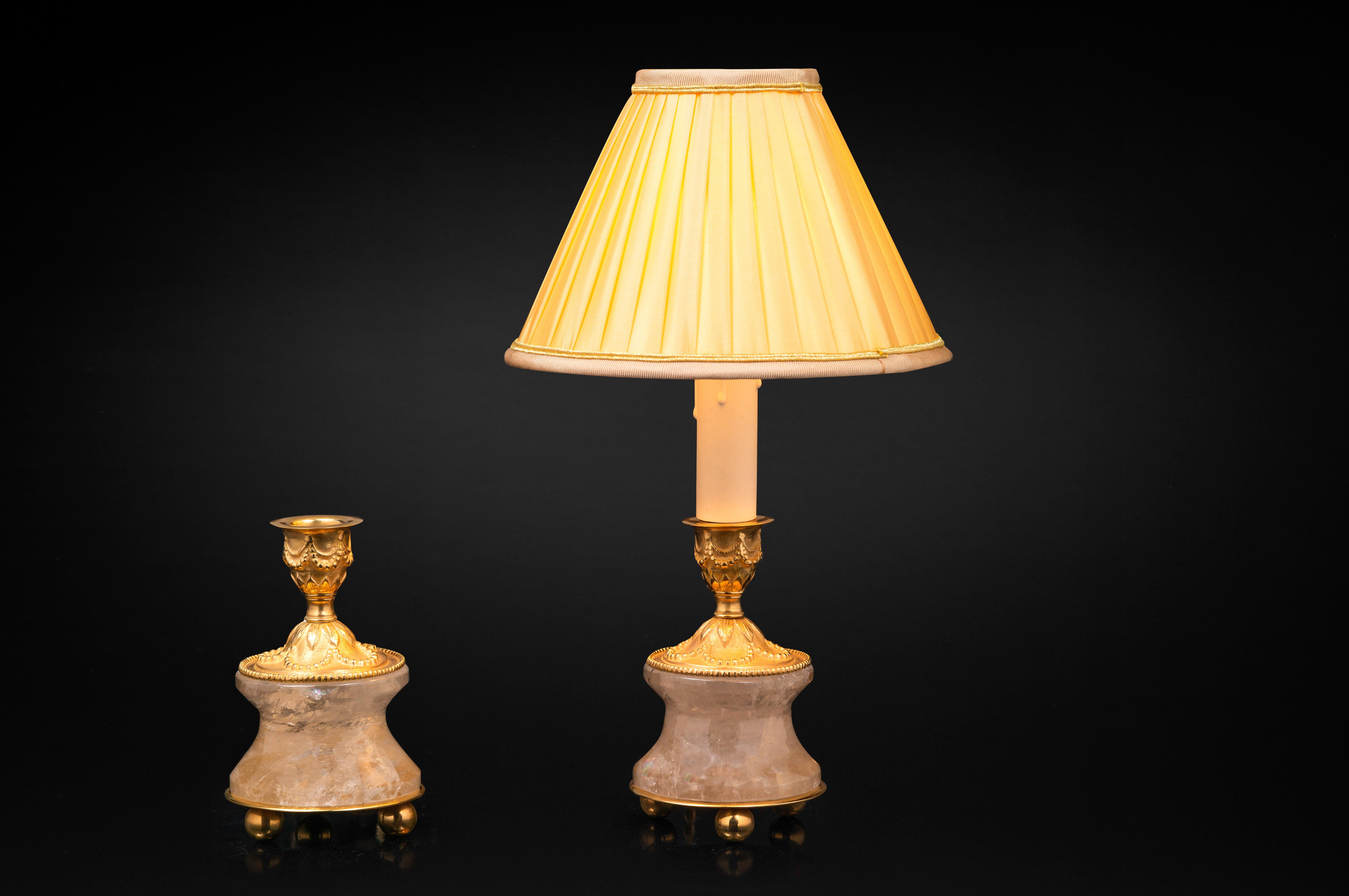 Very chic pair of rock crystal pair of lamps /candlesticks in the typic style of Louis XVI.
So you can used as you want, depend of your interiors and mood.
The base is carved in a single piece of rock crystal stone.
The top is made in France in