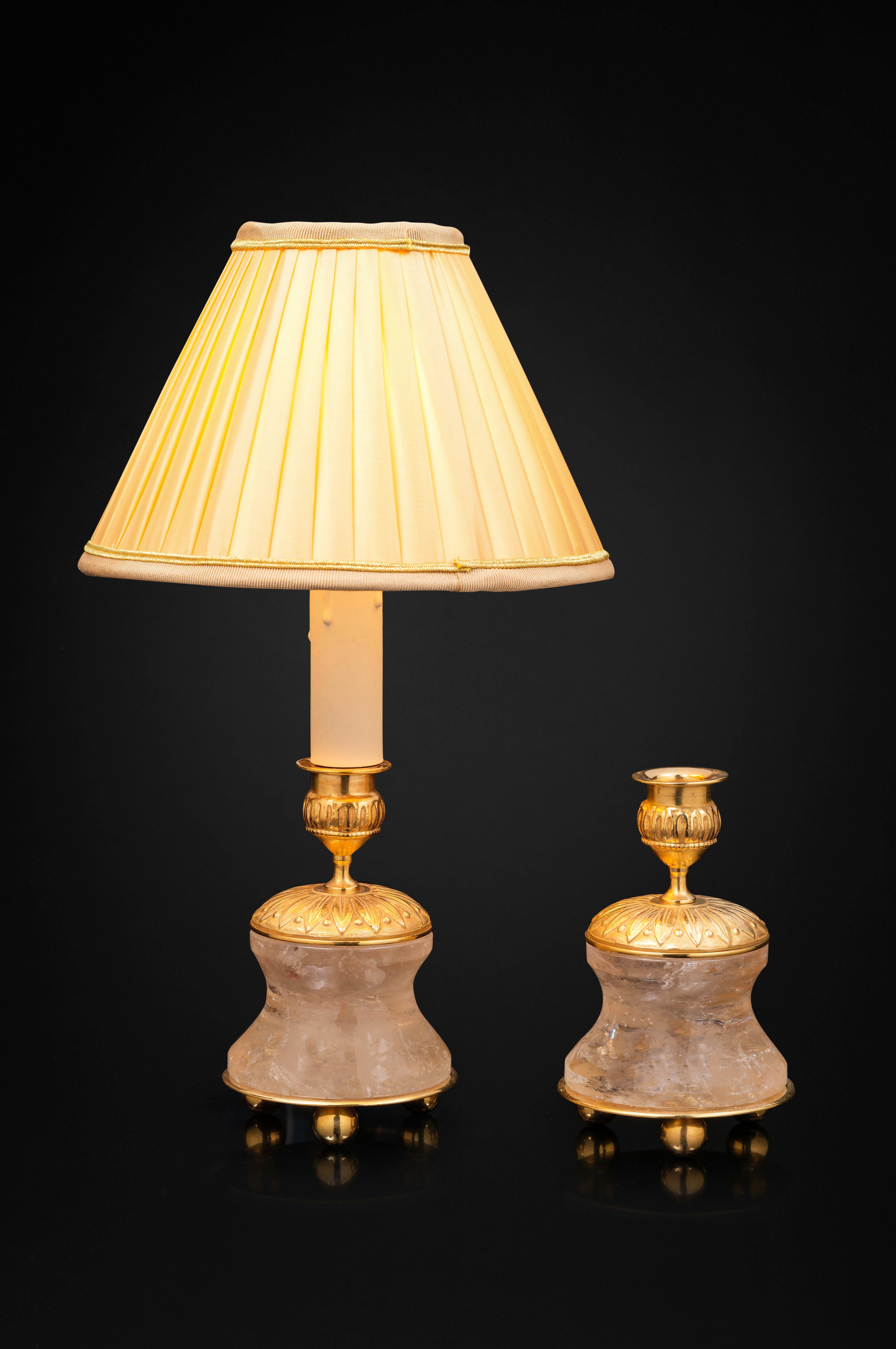 Amazing pair of rock crystal pair of lamps /candlesticks in the typic style of Louis XVI.
So you can used as you want, depend of your interiors and mood.
The base is carved in a single piece of rock crystal stone.
The top is made in France in