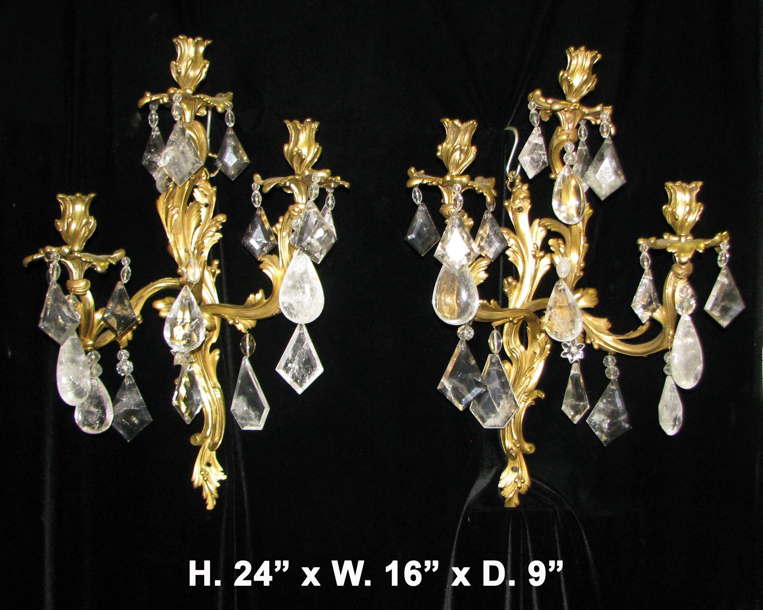 Fine opposing pair of 19th century French Louis XV style ormolu and rock crystal three-light sconces with acanthus motif throughout.
Meticulous attention has been given to every detail.
Measures: H. 24