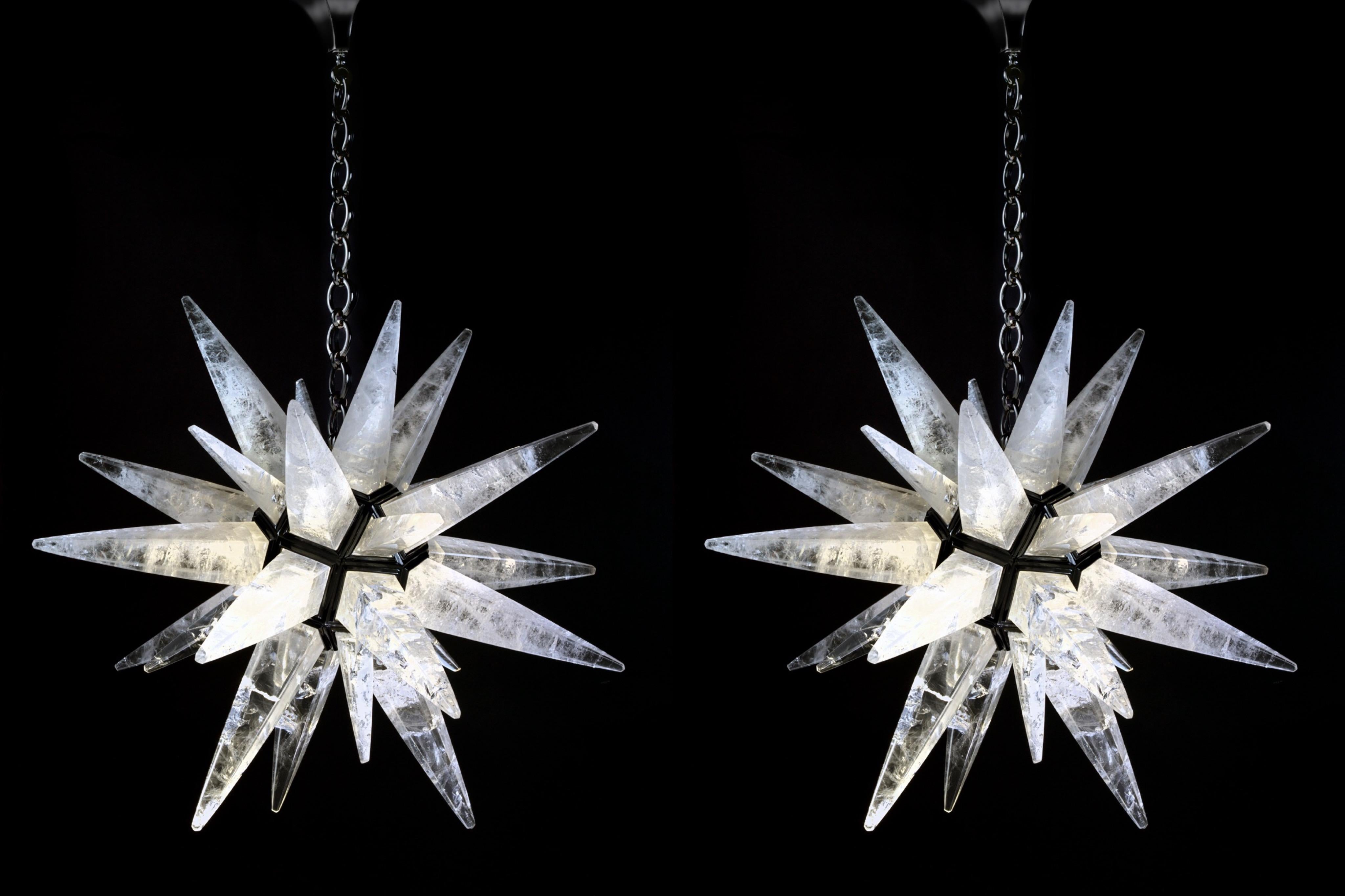 Rock crystal quartz star light black edition.
This rock crystal star lighting is made in France.
The fixture, the chain and the canopy of this rock crystal lighting are handmade in bronze.
This rock crystal light could be also customized in other