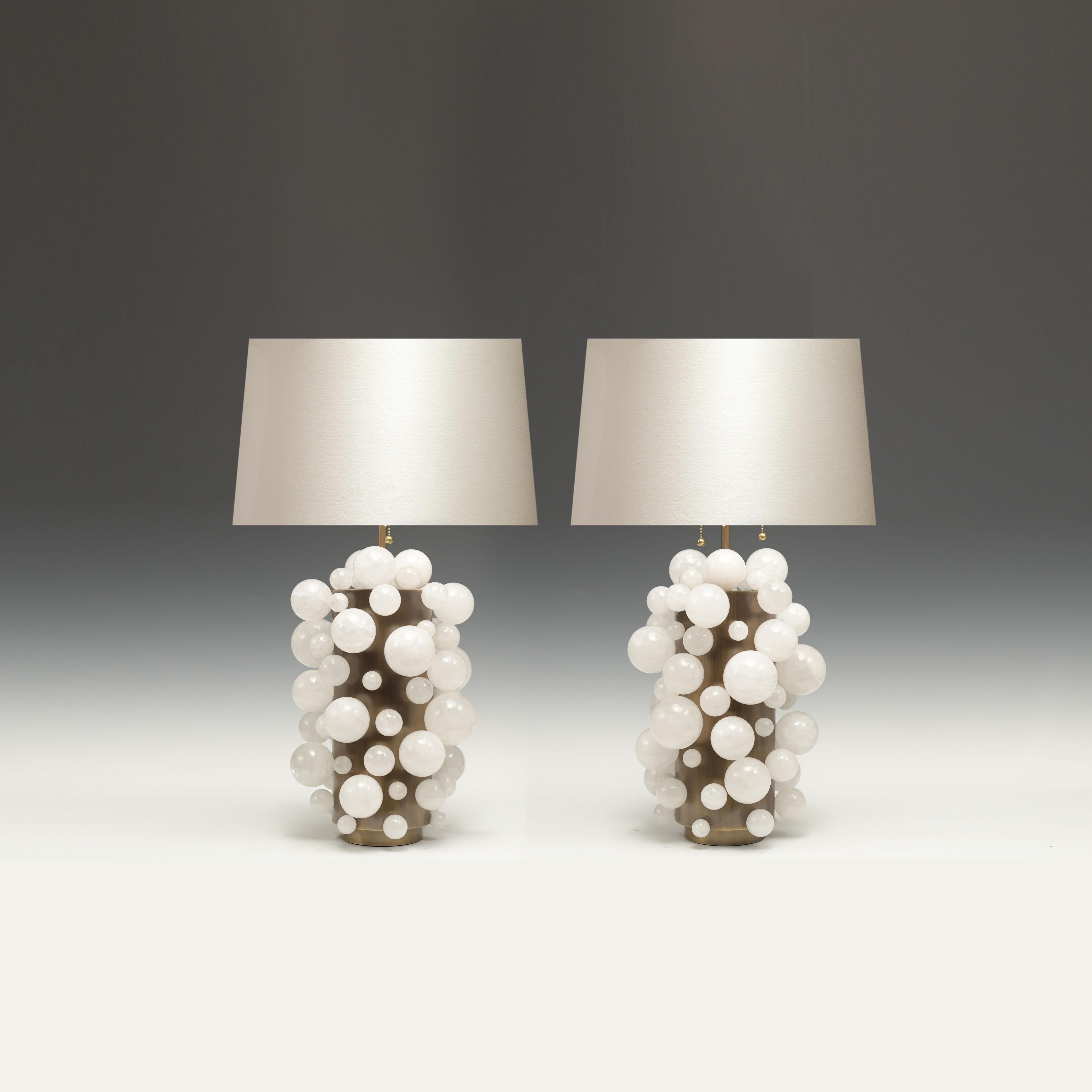 A pair of luxury white rock crystal quartz bulb lamps with antique brass bases, created by Phoenix Gallery, NYC.
To the top of the rock crystal 17 inch
Lampshade not included. Custom size available.