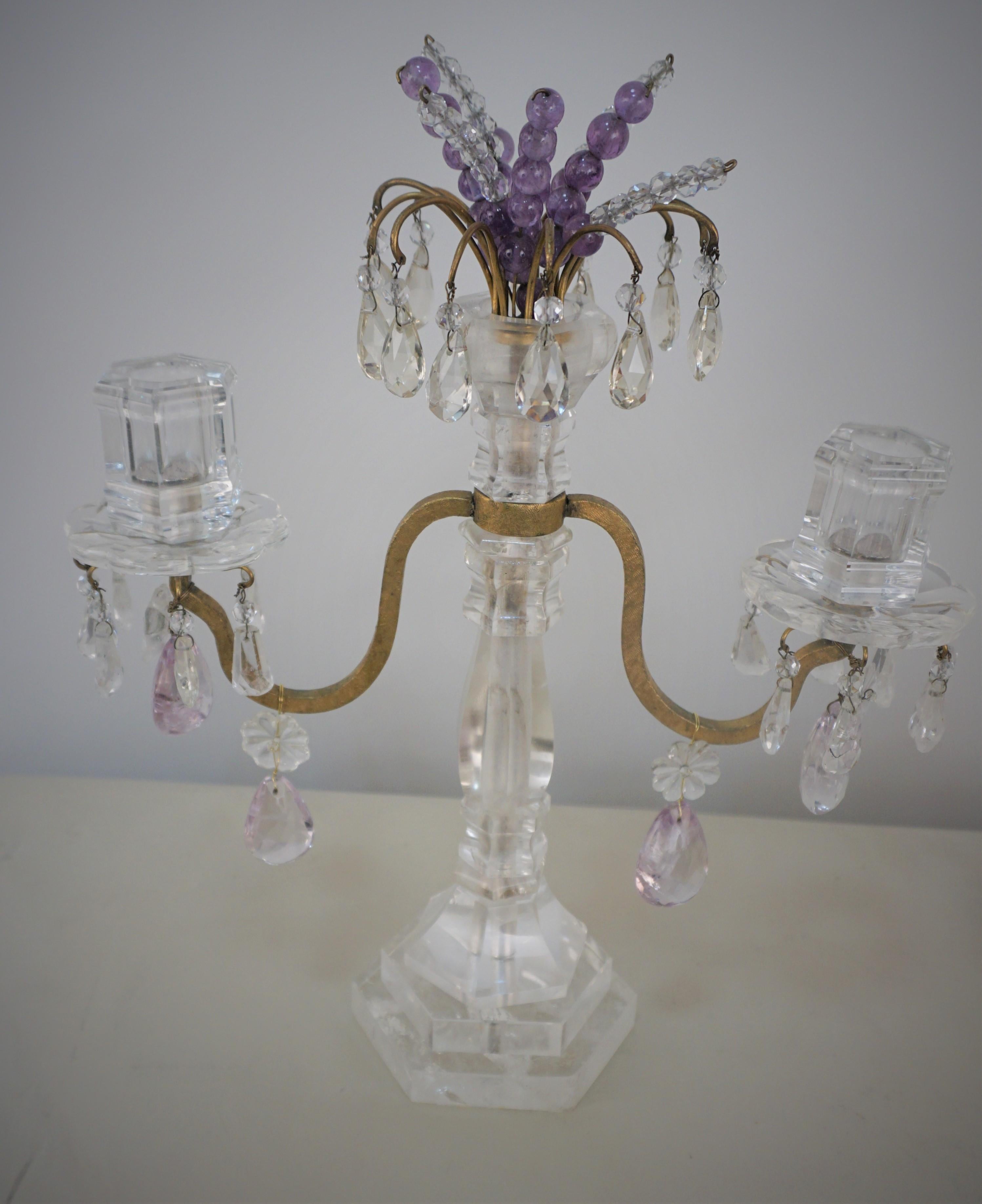 Pair of beautiful 1950's double arm rock crystal candelabras with gilt bronze arms.
Few of small crystal drops have been replaced with regular crystals.