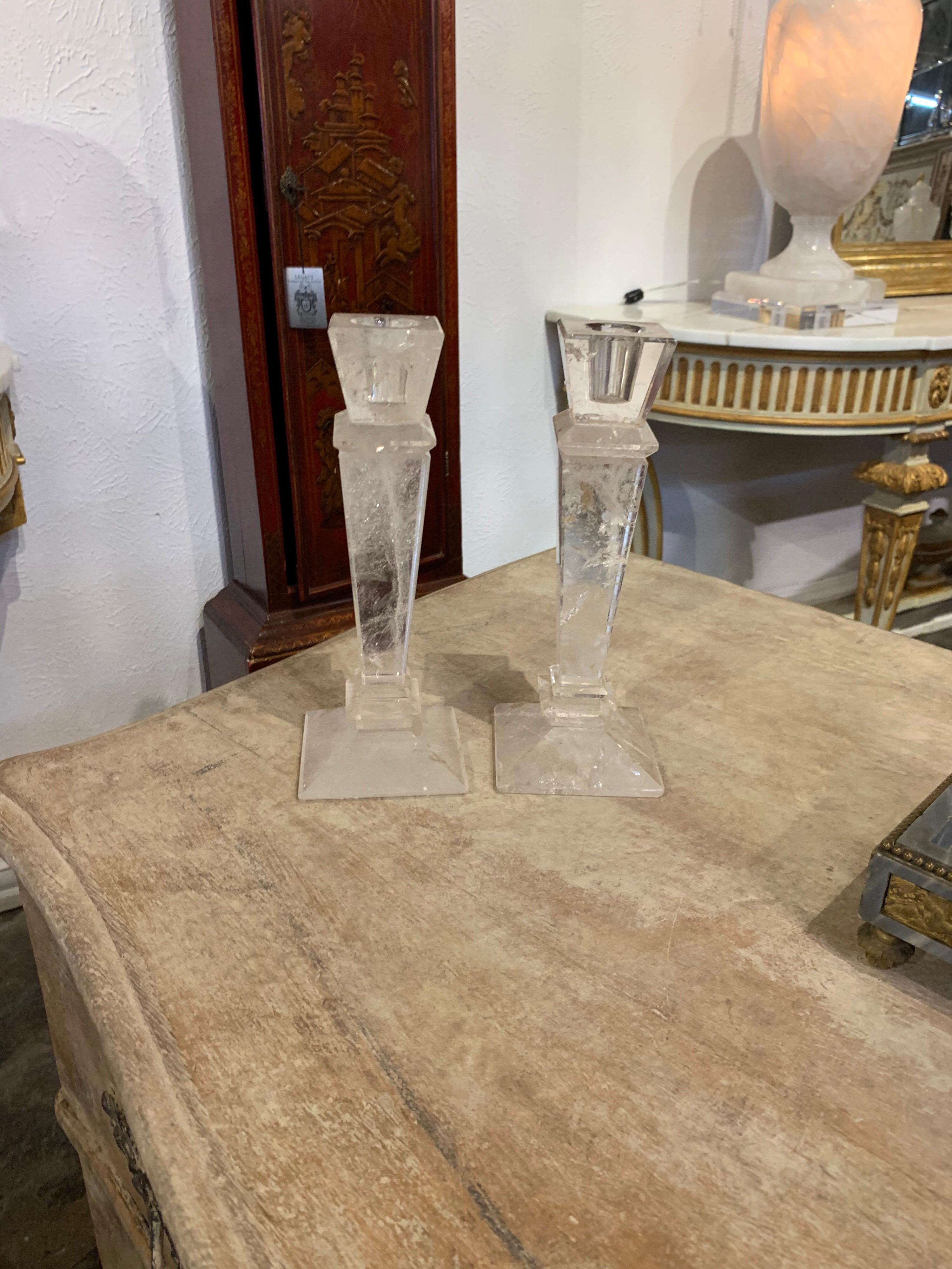 Very decorative pair of rock crystal candlesticks. Exceptional quality. Makes a beautiful accessory!