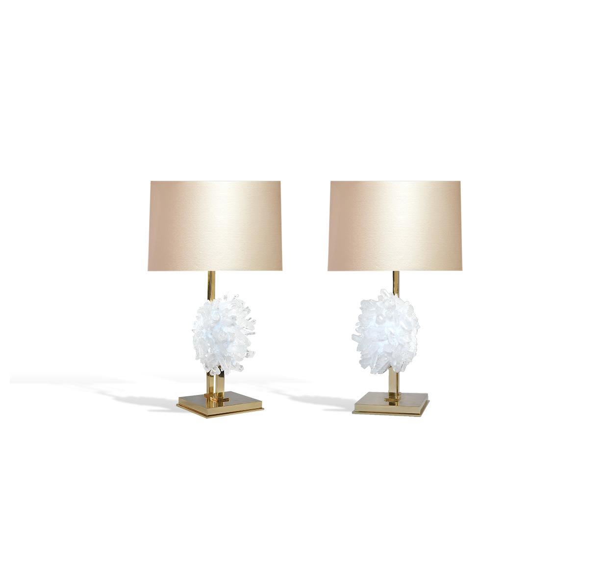 Pair of rock crystal clusters mount as lamps. Polish brass stand.
Created by Phoenix.
To the top of the rock crystal part: 13 in H
each lamp installed two standard sockets
lampshade not included.