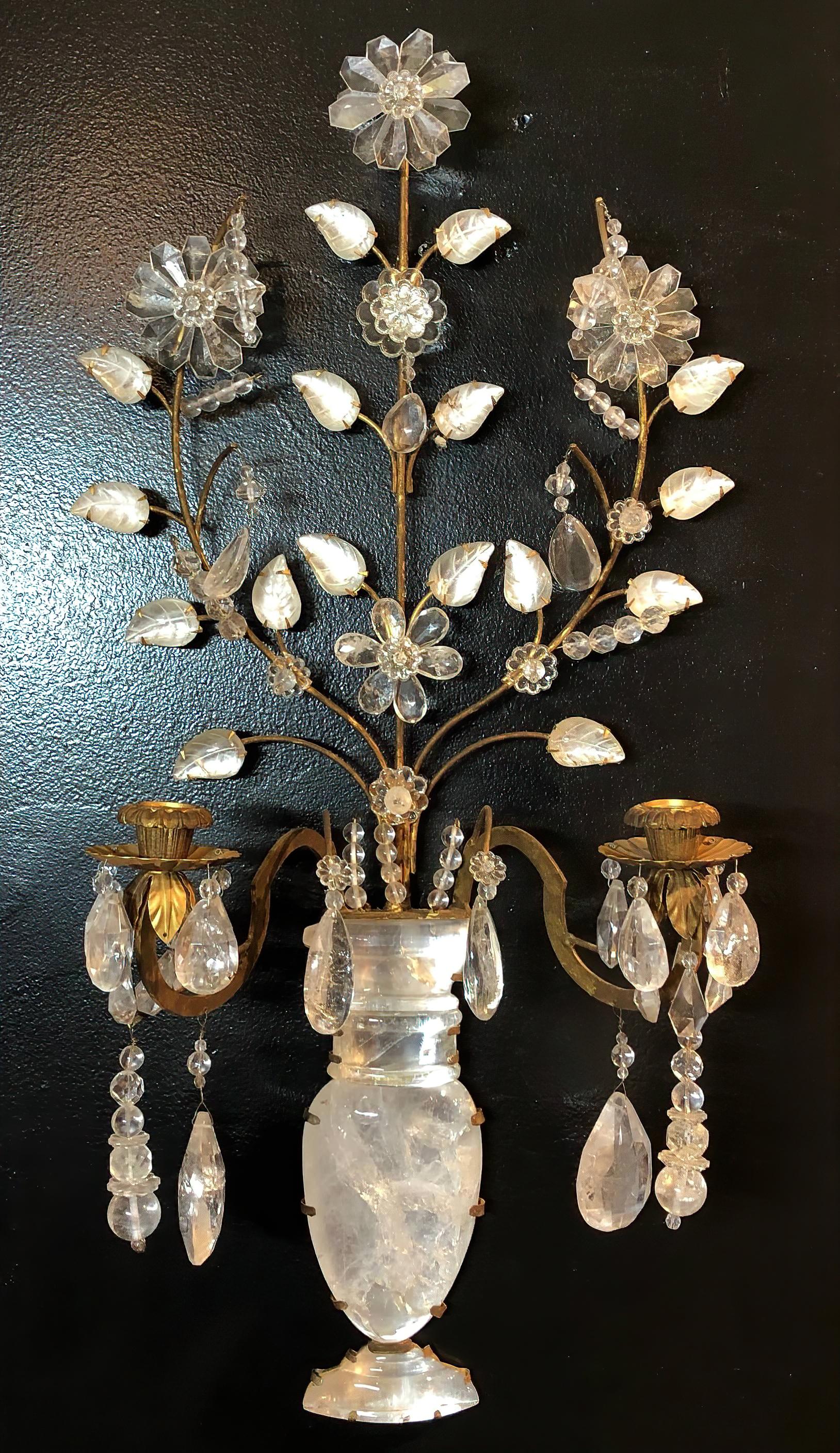 Pair of neoclassic two light rock crystal wall light sconces with brass and rock crystal flower petals, a long flower urn form back with brass frame and cups. In the Bagues manner.