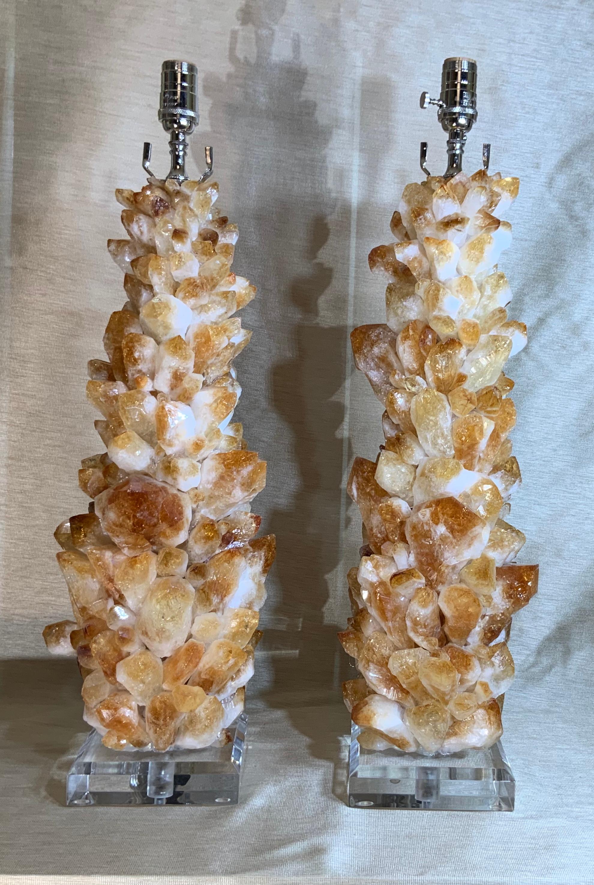 Exceptional pair of table lamps artistically handcrafted of large and smaller genuine Citrine rock quartz crystal pieces, to make beautiful and impressive pair of table lamps, one of a kind by joseph Malekan.
Beveled Lucite base 6”x 6” x