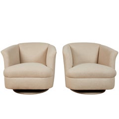 Pair of Rocking and Swivelling Club Chairs